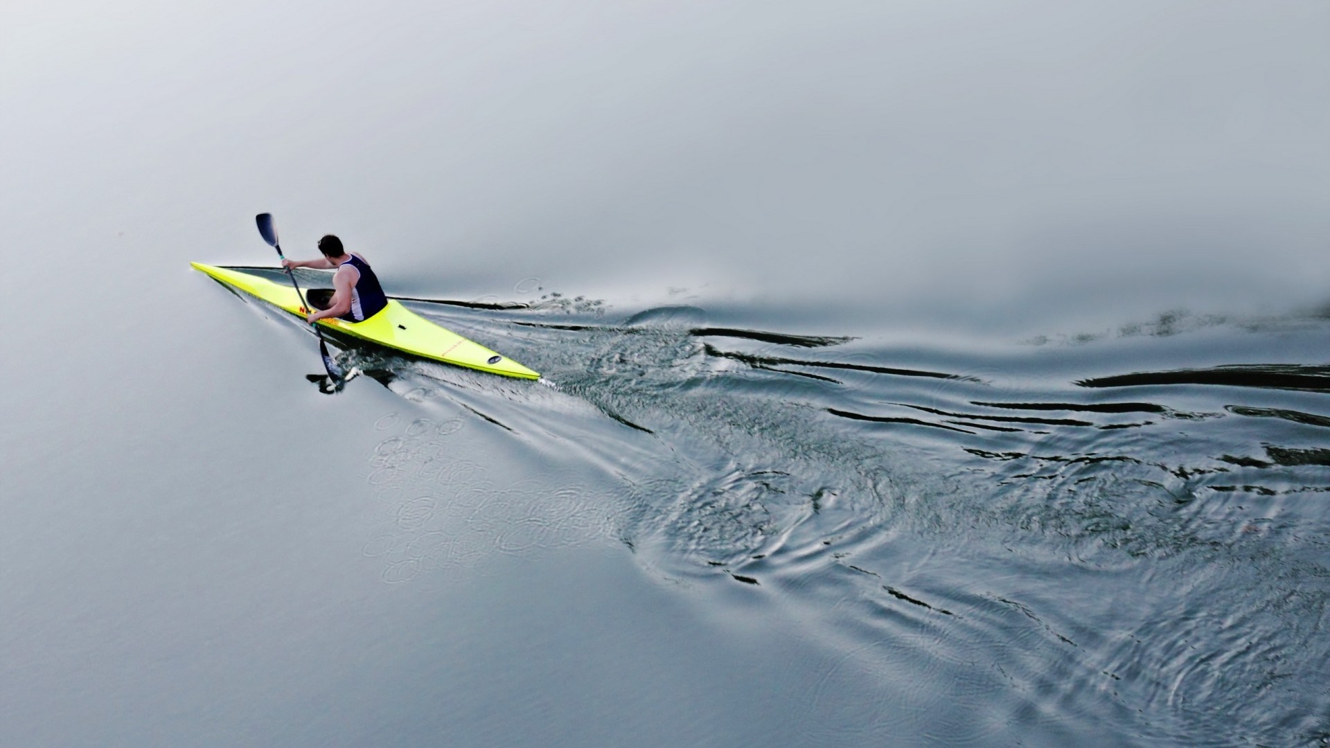 Man kayaking on a calm lake HD Wallpaper