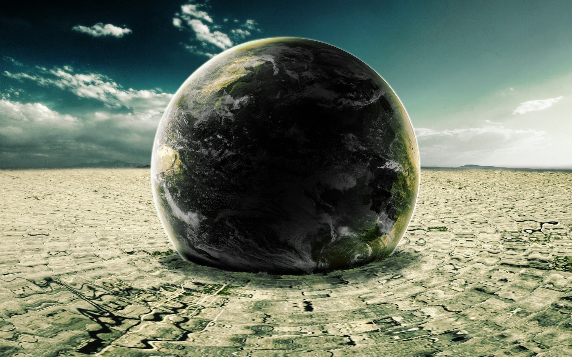 Earth planet on cracked dry ground with clouds HD Wallpaper