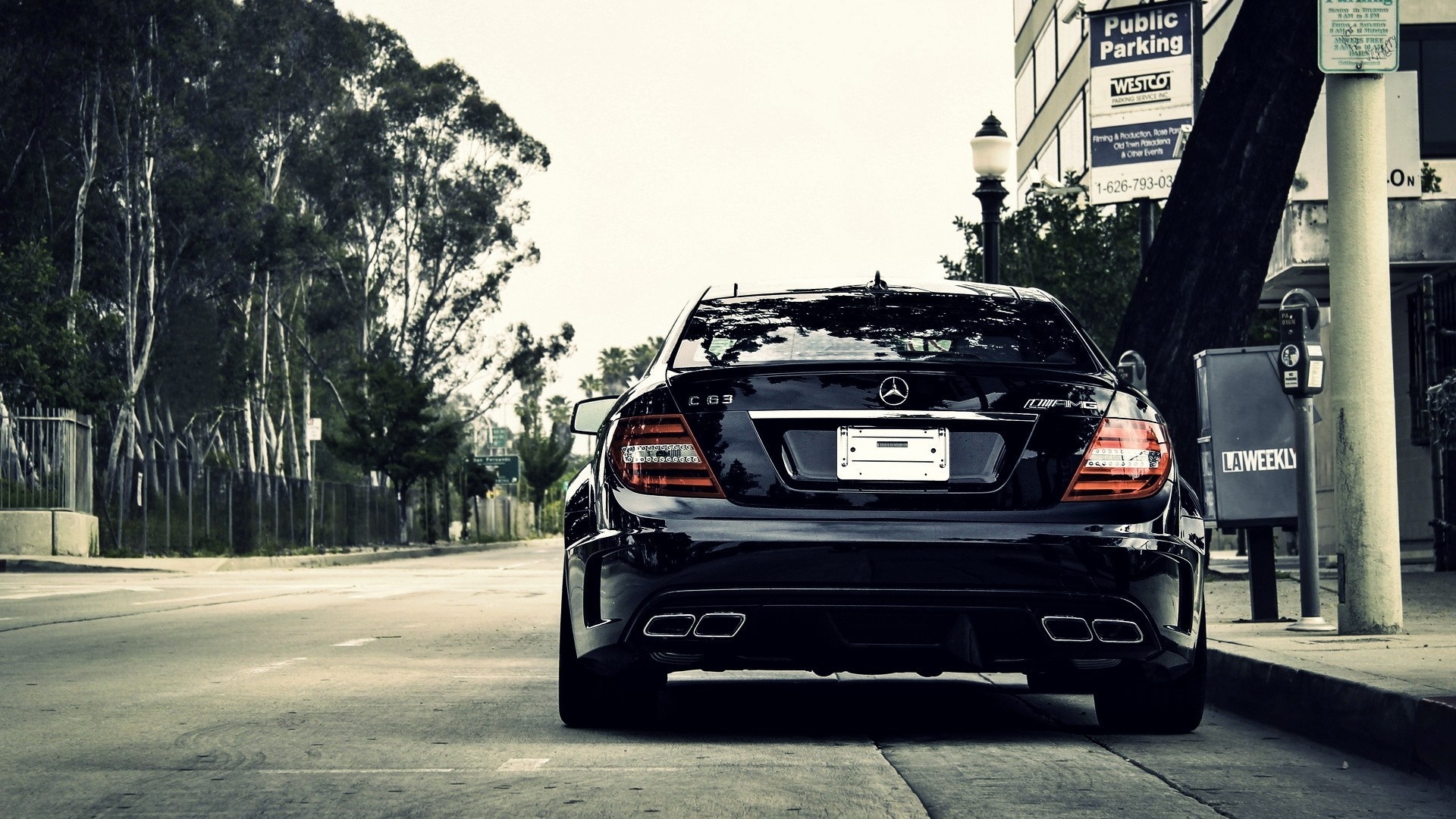 Black Mercedes-Benz C63 AMG parked on street HD Wallpaper