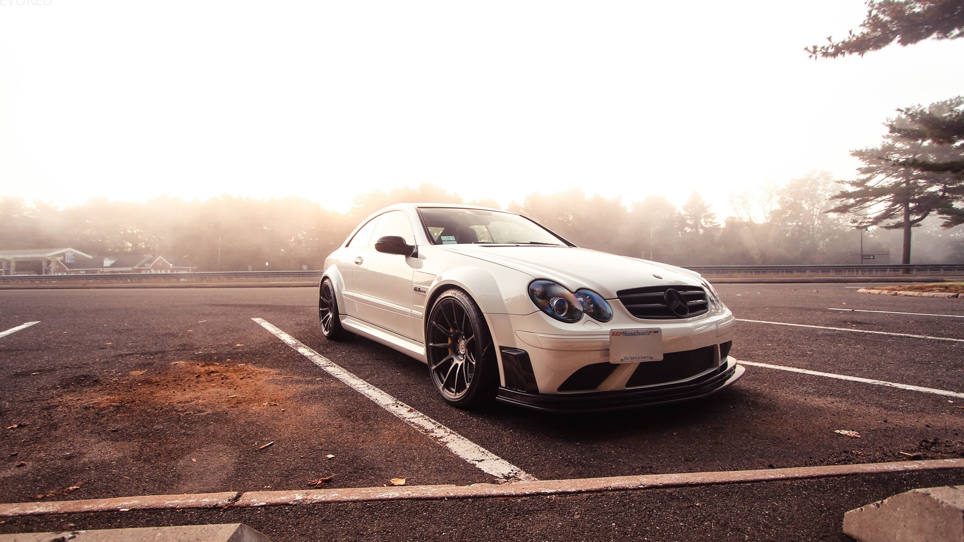 White Mercedes-Benz CLK Class parked in a foggy lot HD Wallpaper