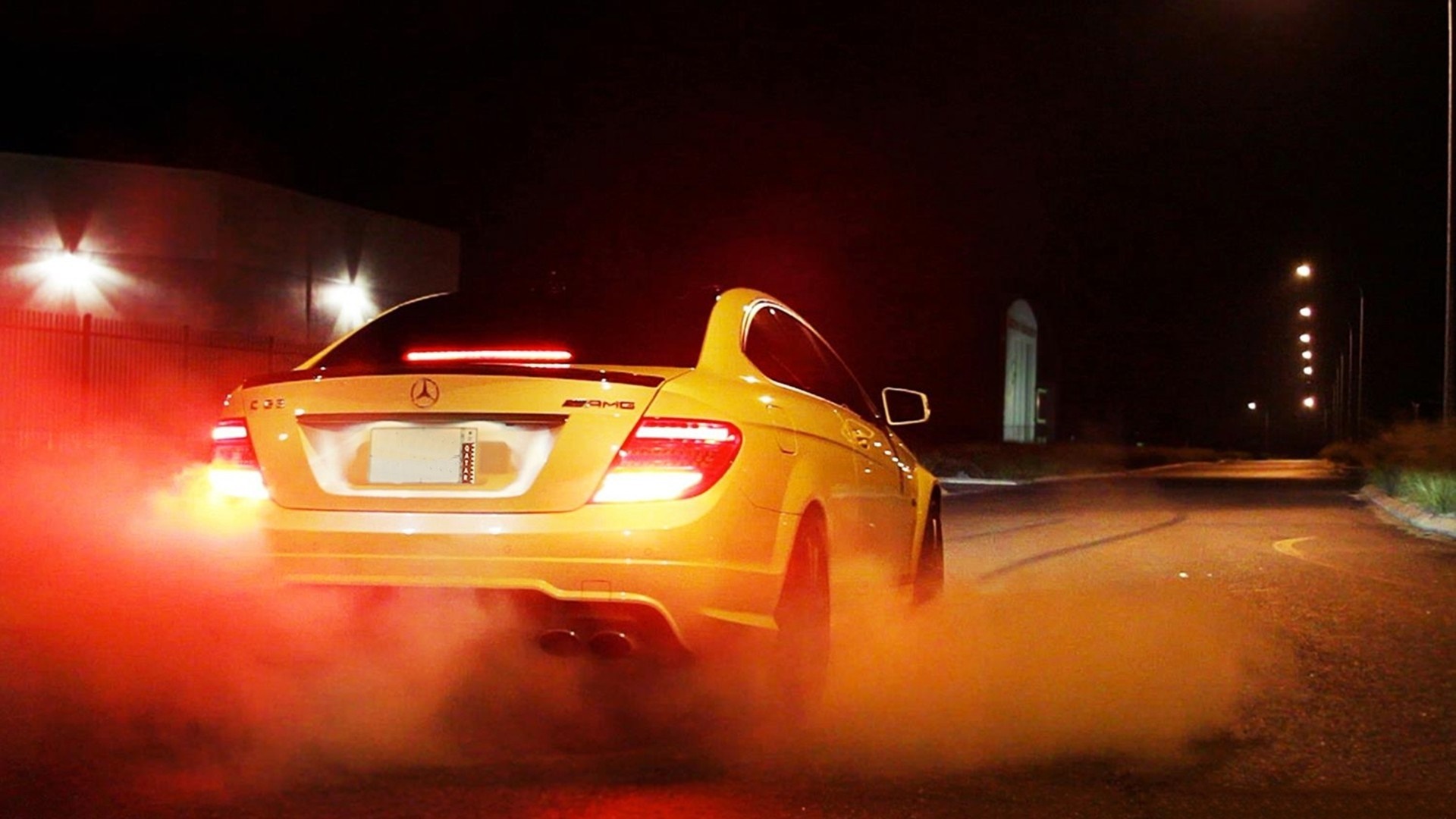 Yellow Mercedes-Benz C63 AMG coupe drifting at night HD Wallpaper