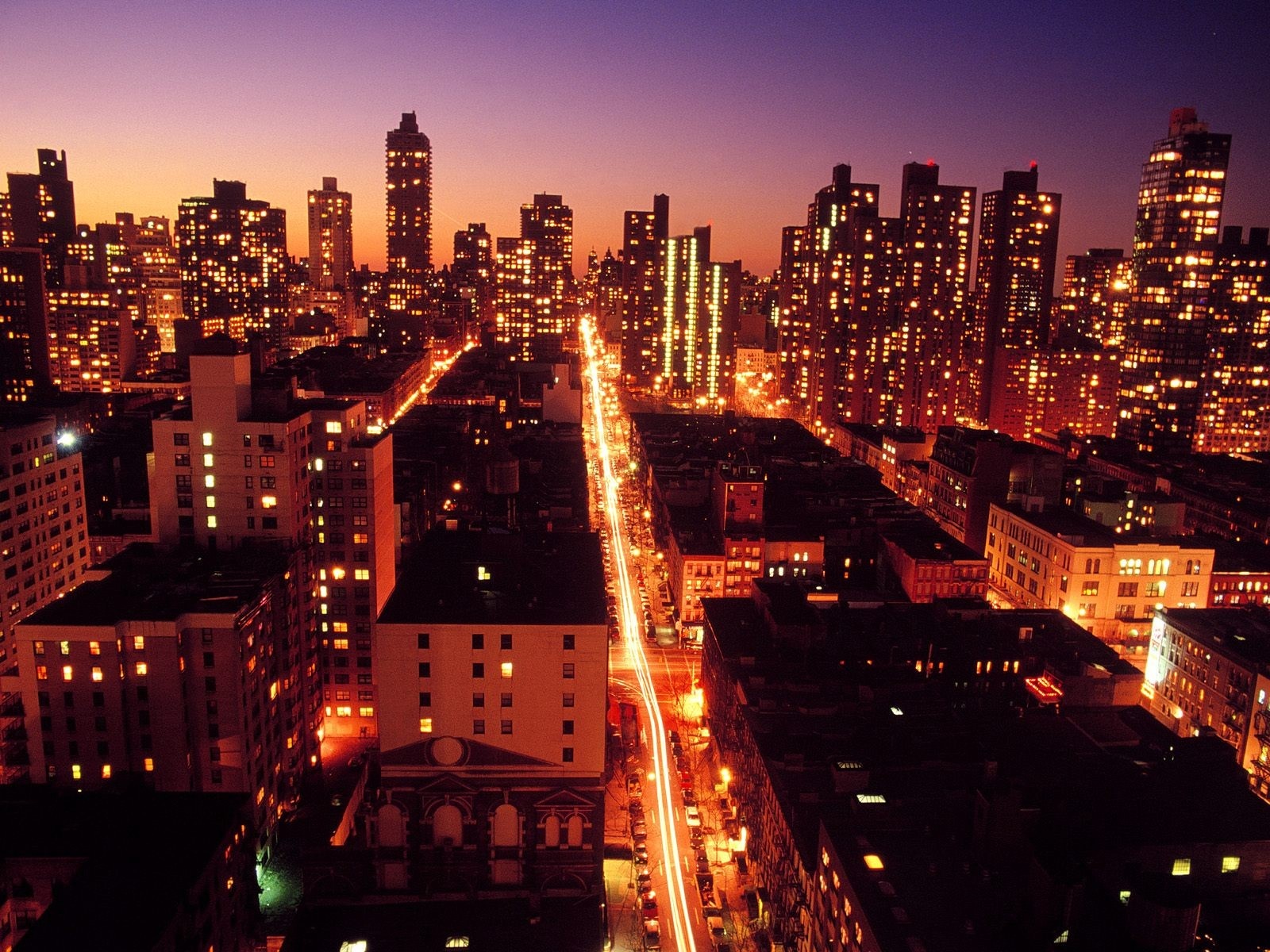 New York City skyline at dusk with long exposure traffic lights HD Wallpaper