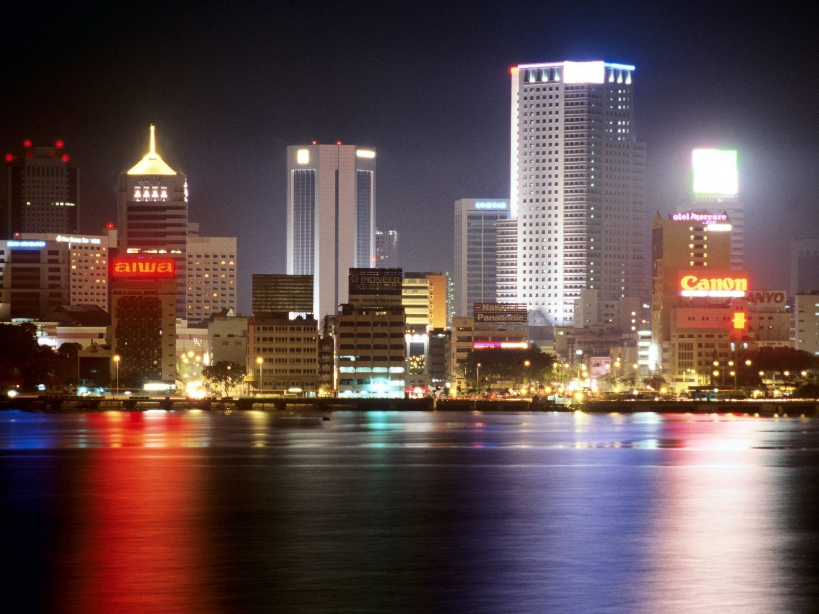 Night cityscape with skyscrapers and water reflections HD Wallpaper