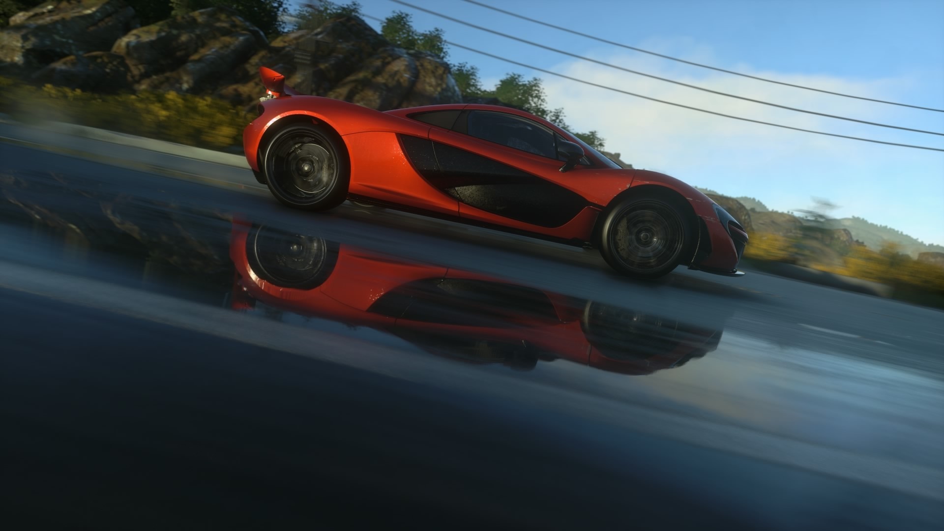 Orange McLaren P1 driving on a wet road HD Wallpaper