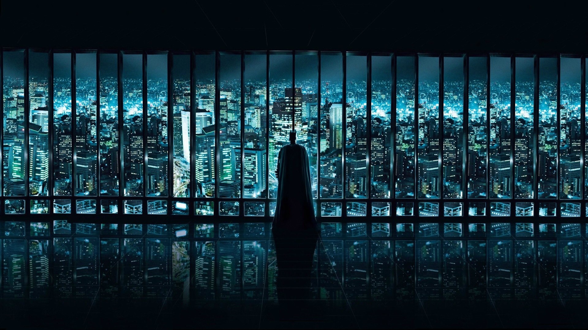 Batman overlooking a futuristic cityscape at night HD Wallpaper