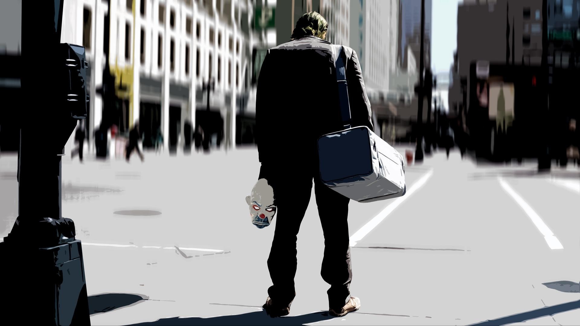 The Joker from The Dark Knight holding a mask HD Wallpaper