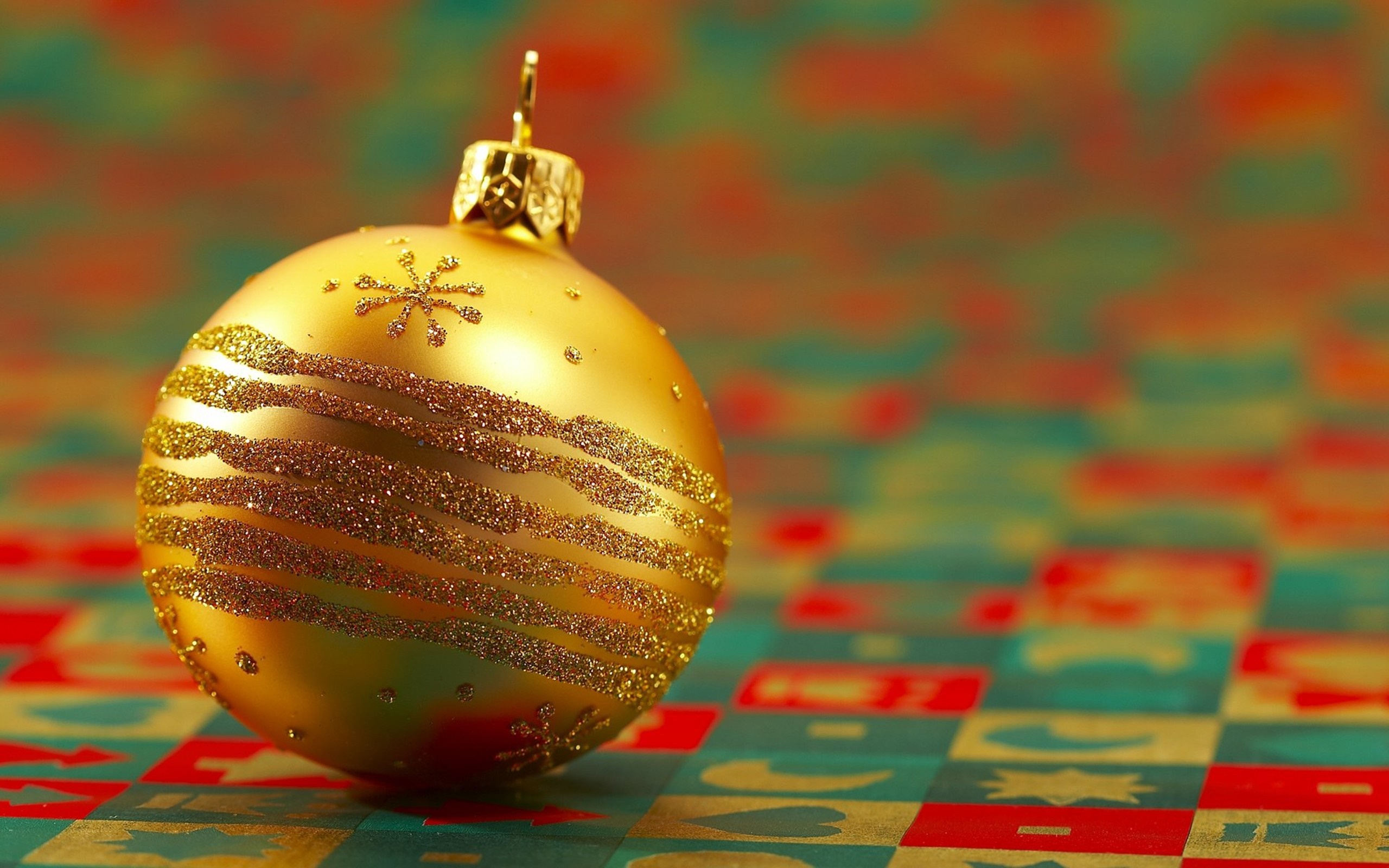 Golden Christmas Ornament with Glittery Stripes HD Wallpaper