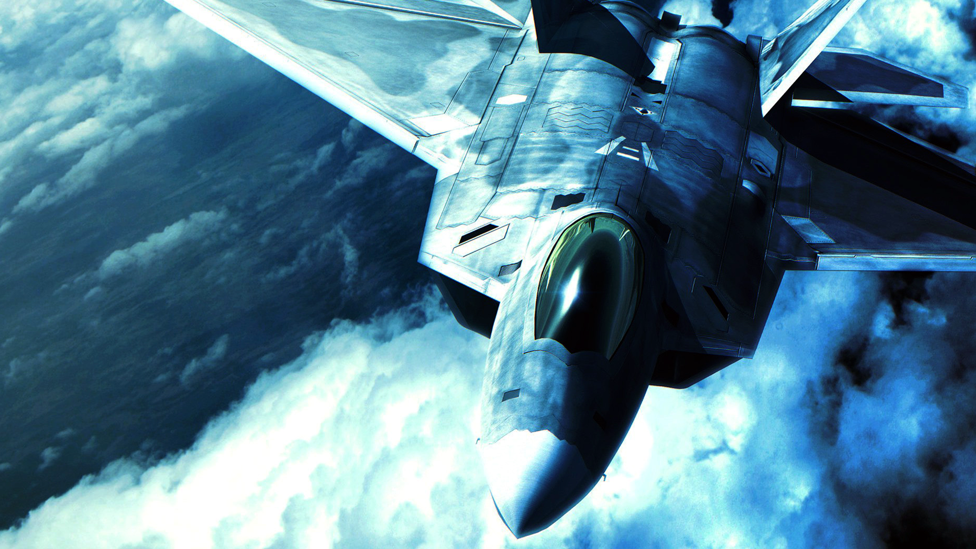 F-22 Raptor fighter jet flying through clouds HD Wallpaper