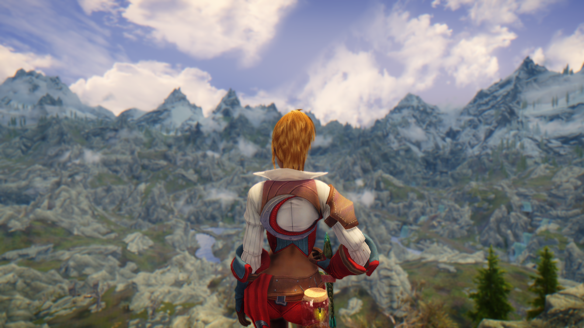 Woman overlooking a vast mountain range in Skyrim HD Wallpaper