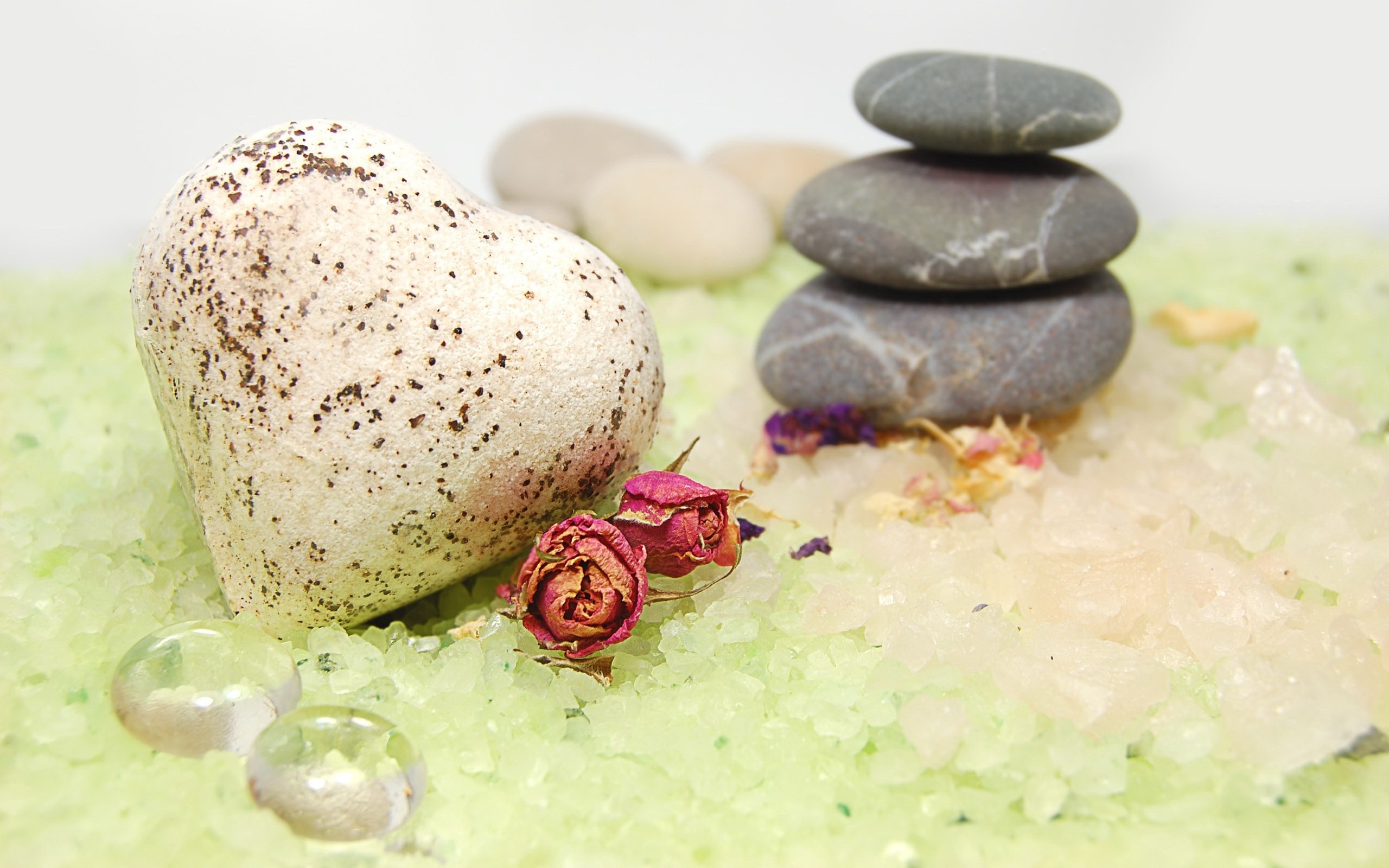 Heart-shaped bath bomb with spa stones and dried roses HD Wallpaper