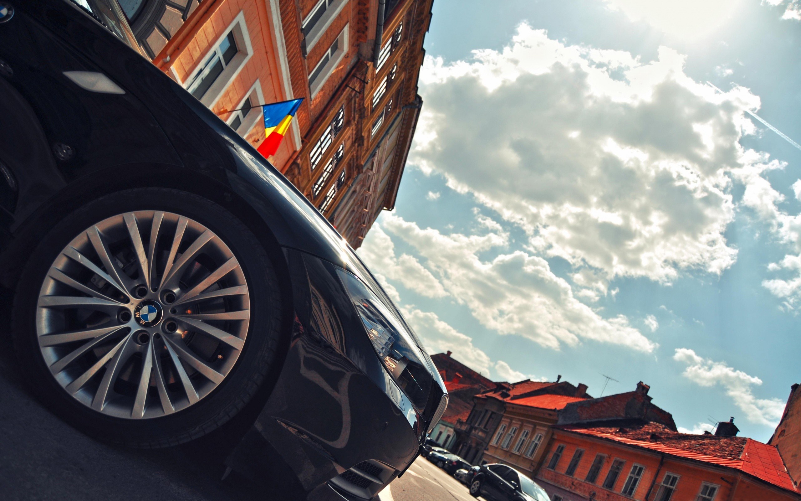 Black BMW Z4 with Romanian Flag on Building HD Wallpaper