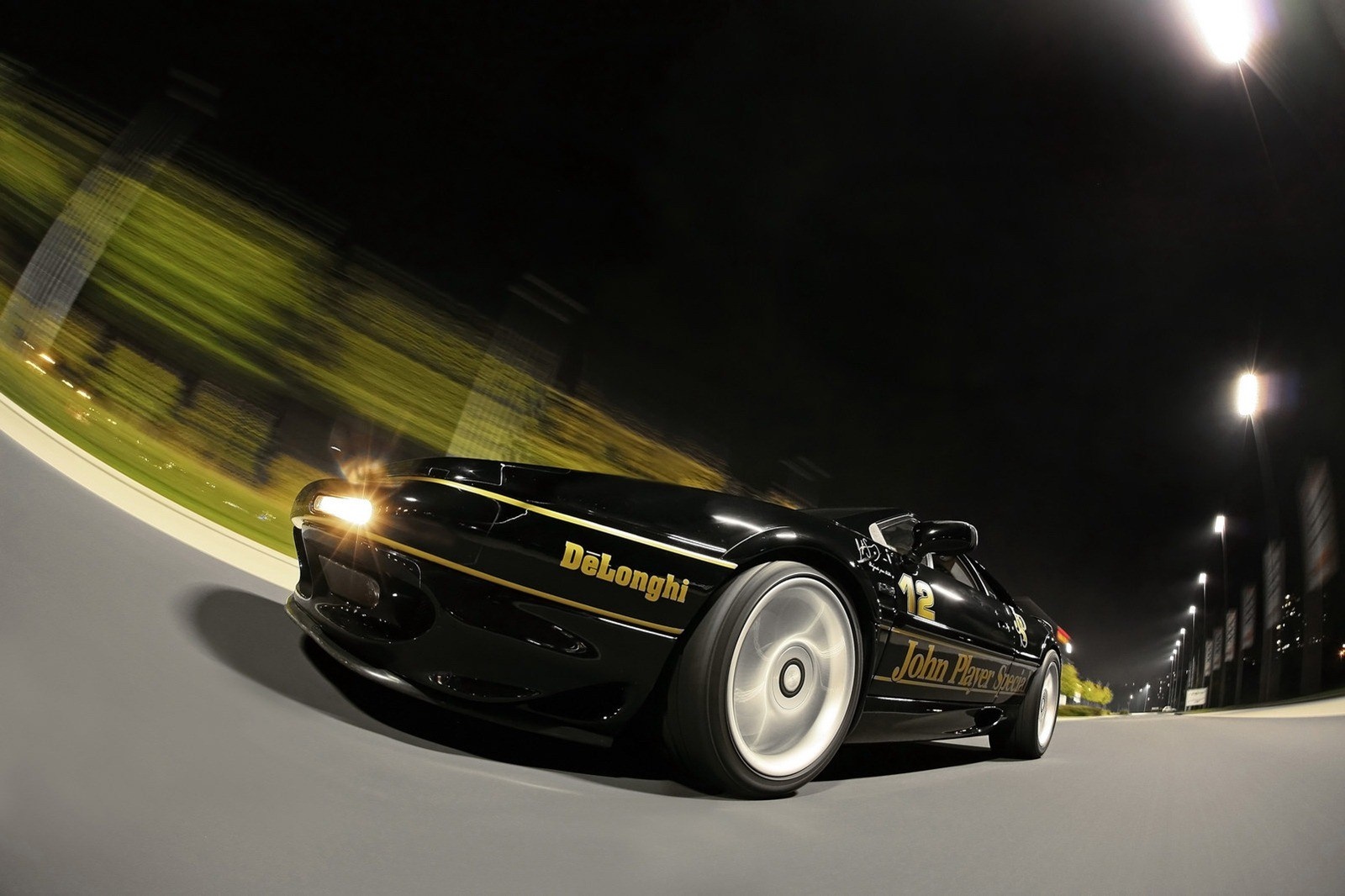 Black Lotus Esprit John Player Special DeLonghi race car at night HD Wallpaper
