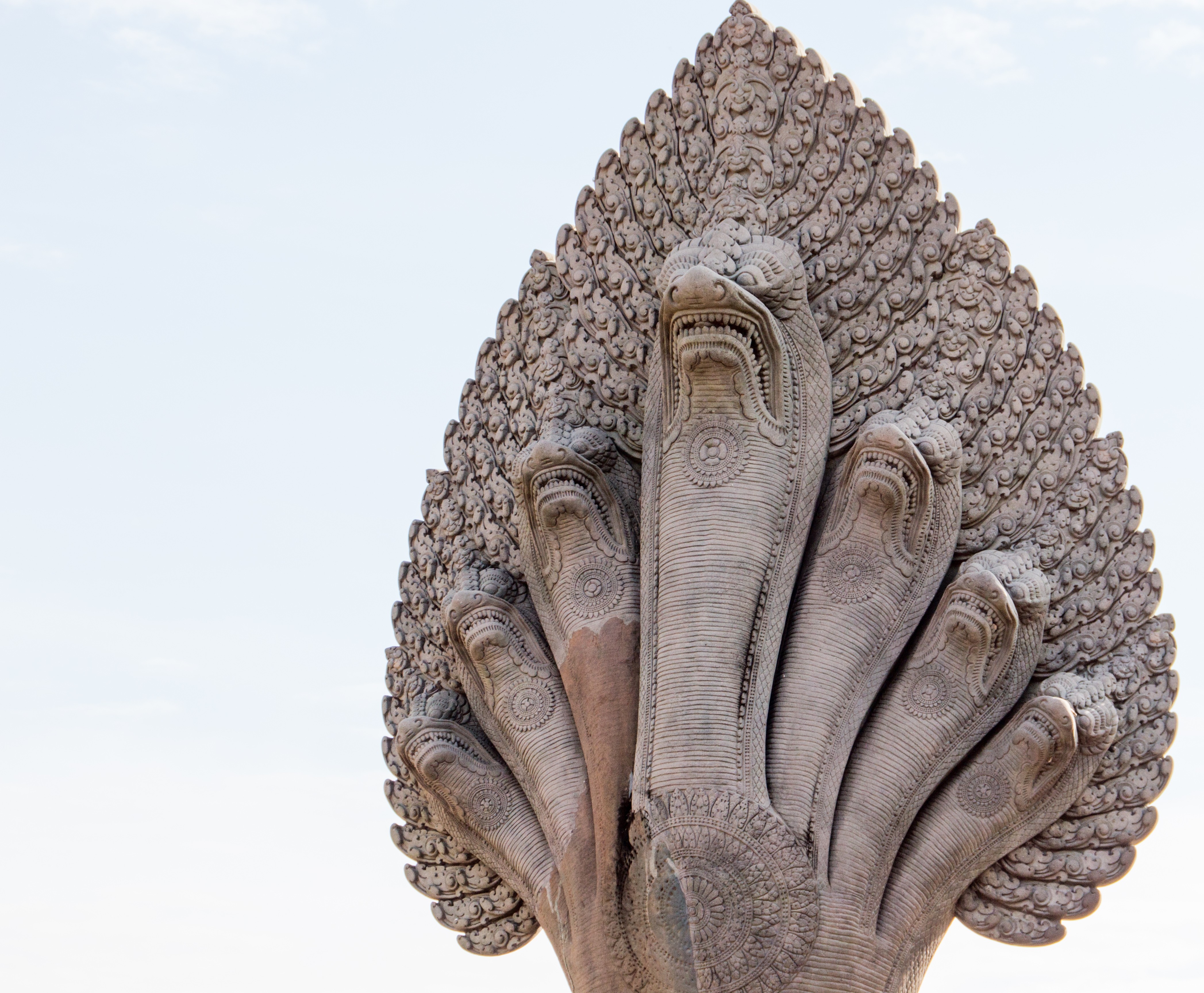 Stone sculpture of a multi-headed Naga statue in Cambodia HD Wallpaper