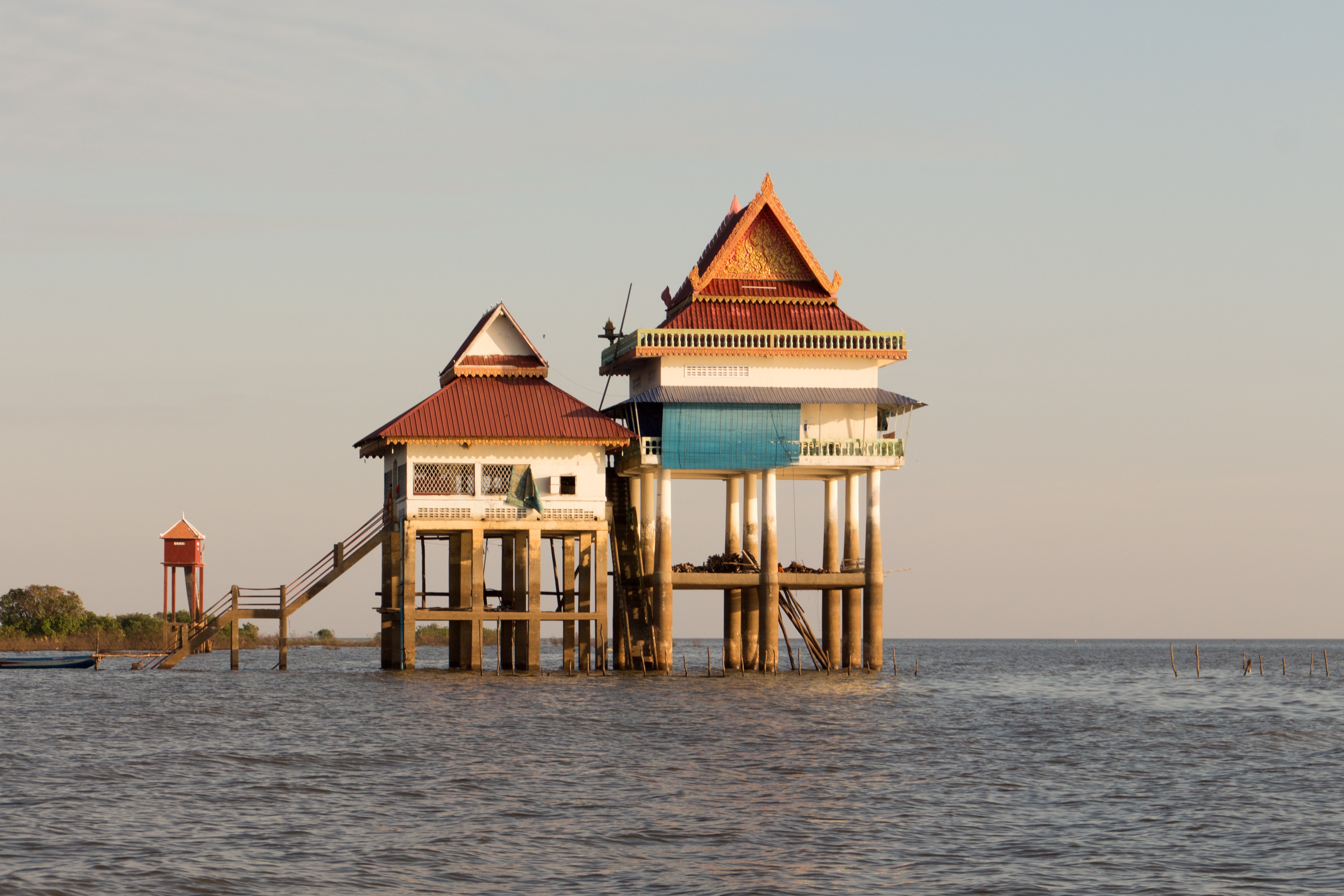 Stilt houses on the water in Cambodia HD Wallpaper