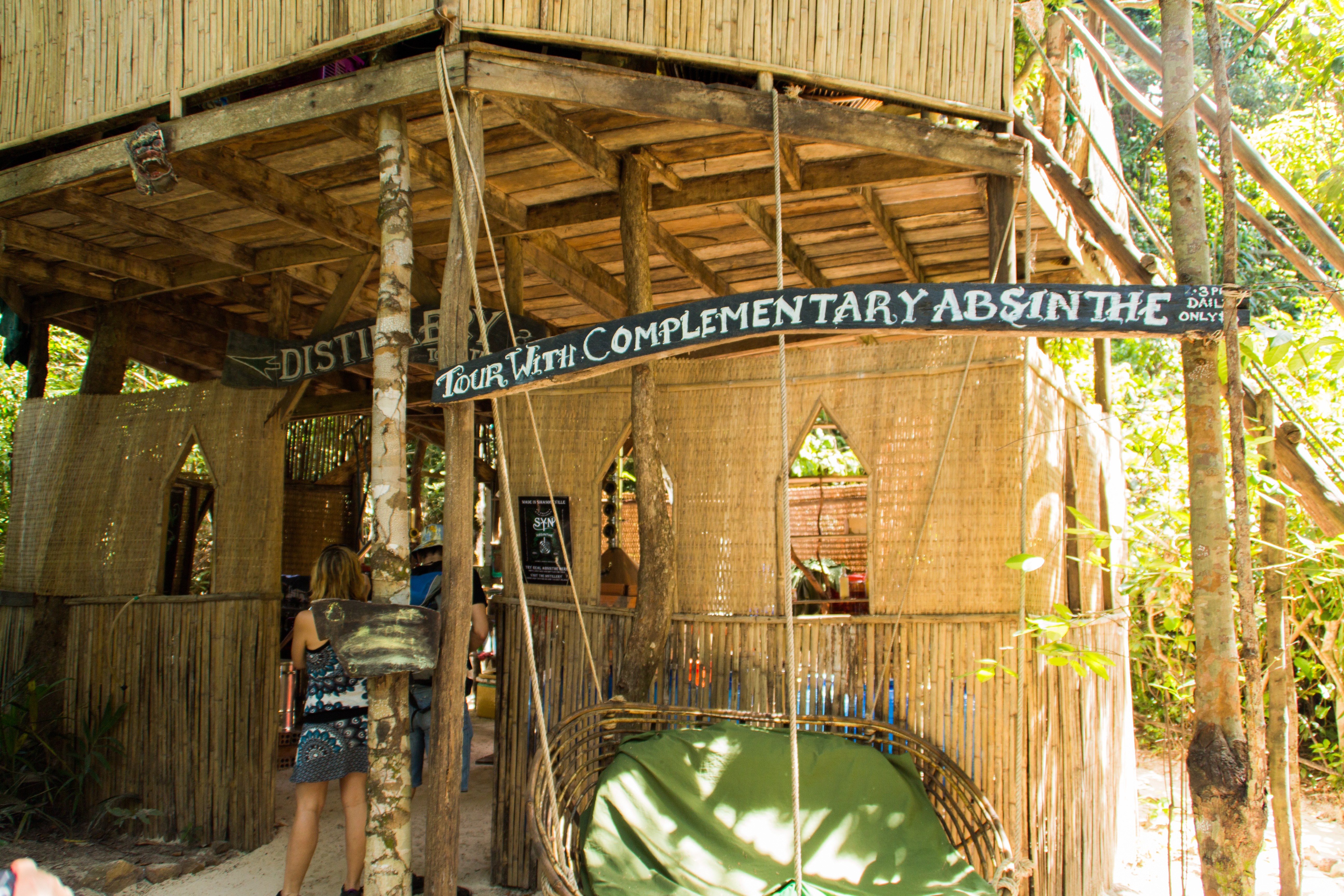 Bamboo structure with sign for distillery tour HD Wallpaper