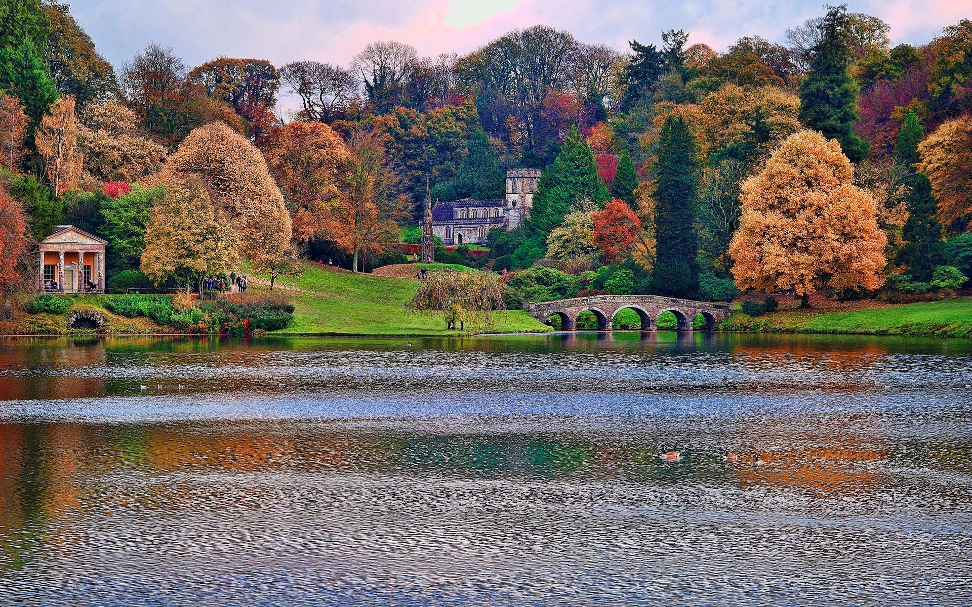 Autumn landscape with lake, bridge, and classical buildings HD Wallpaper