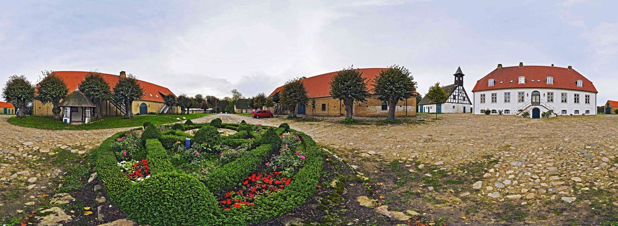 Panoramic view of a rural estate with a manor house and farm buildings HD Wallpaper