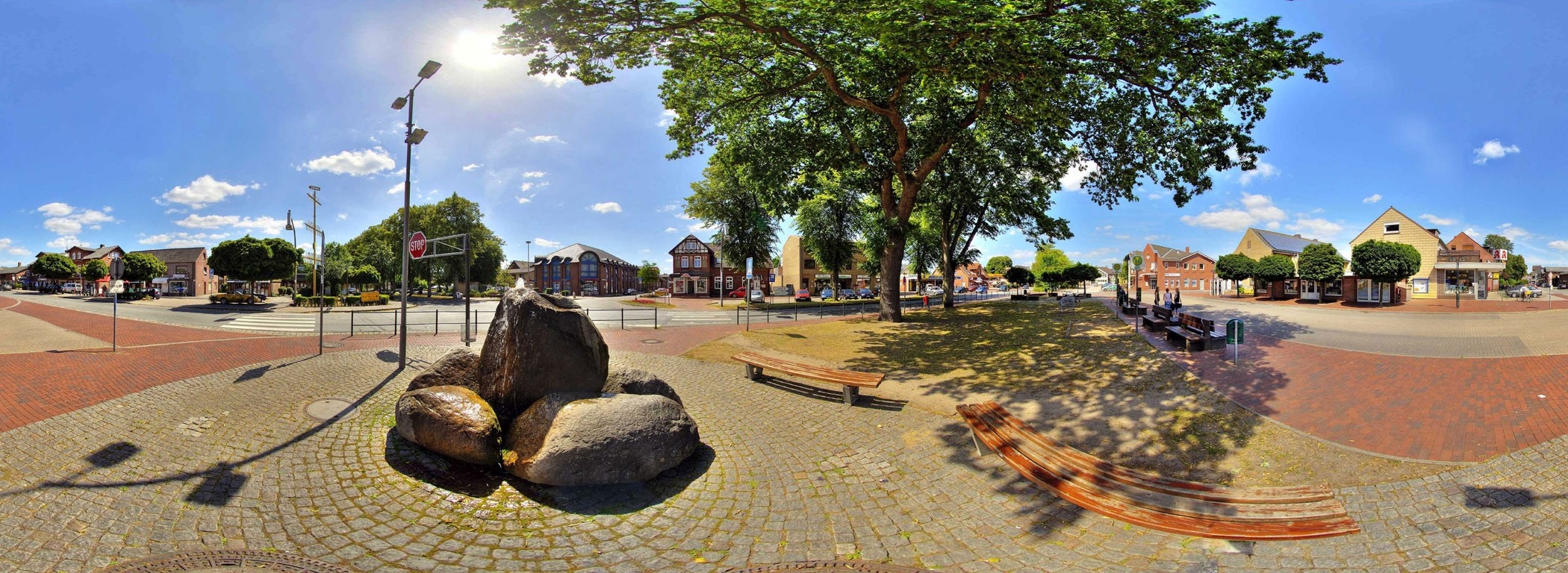 Town square with fountain and trees HD Wallpaper