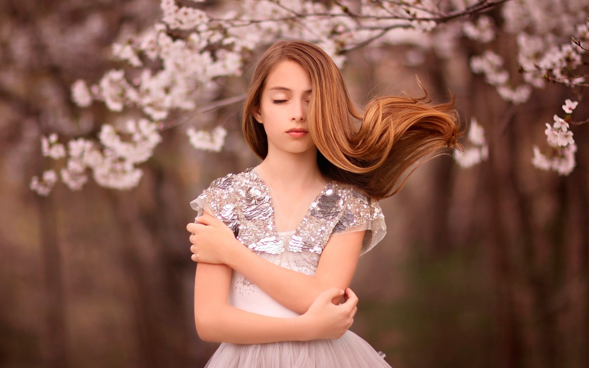 Young girl in a sequined dress with eyes closed HD Wallpaper