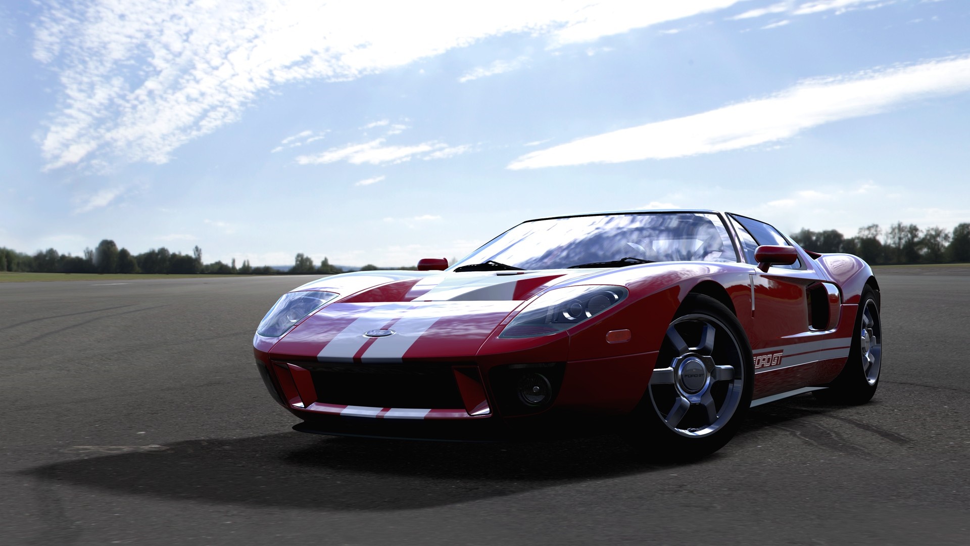 Red Ford GT with white stripes on a track HD Wallpaper