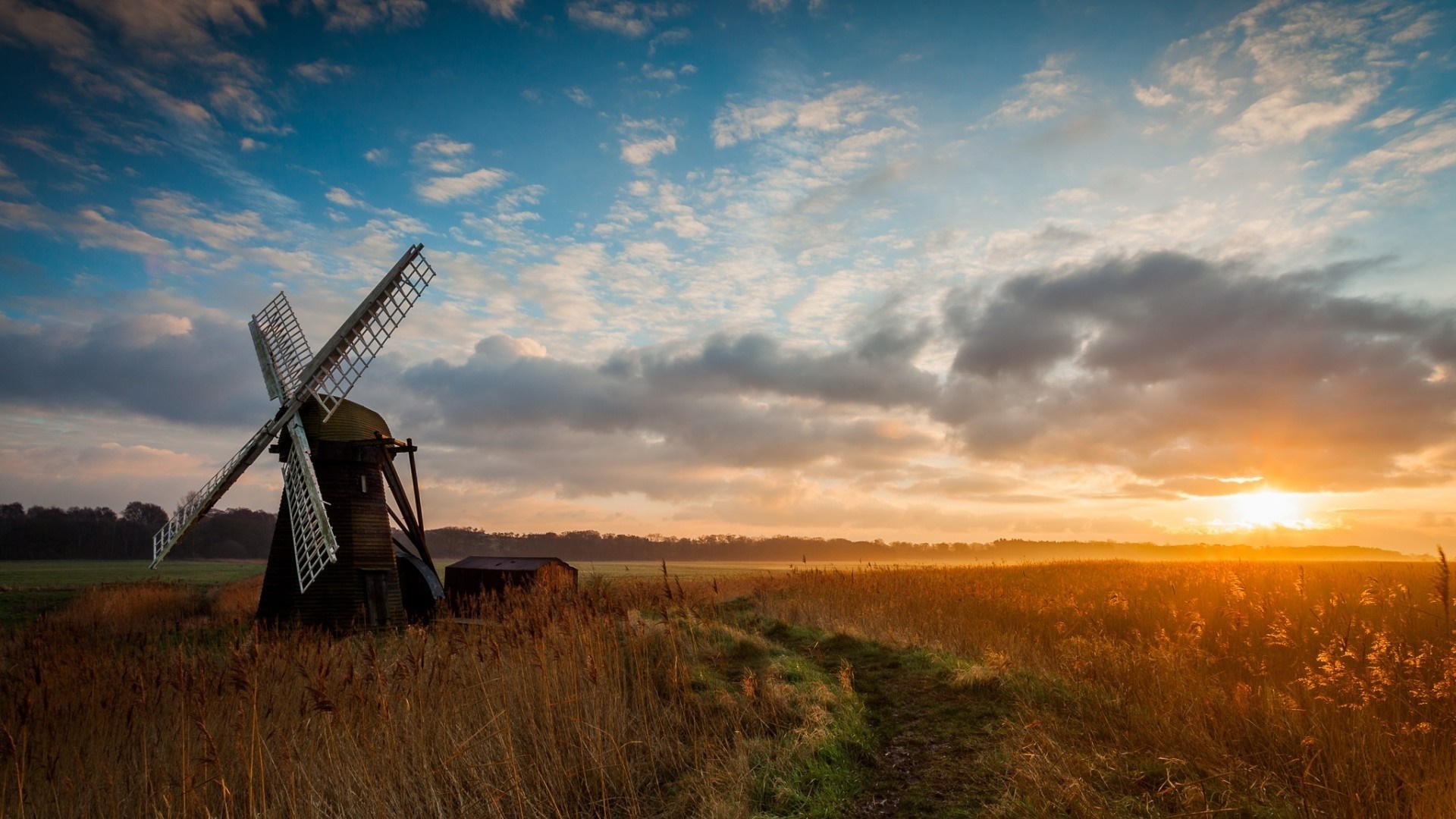 Windmill in a field at sunset HD Wallpaper