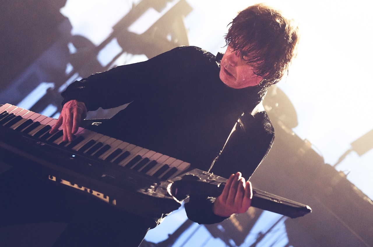 Jean-Michel Jarre playing a keyboard during a concert HD Wallpaper