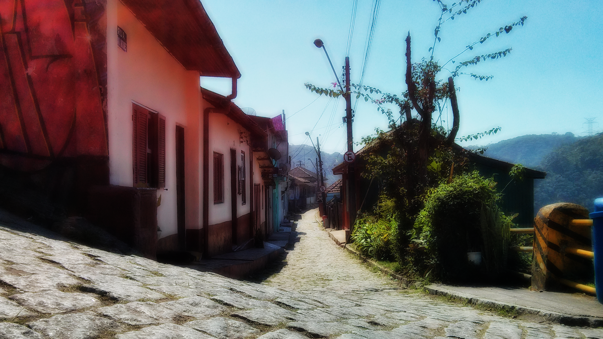 Cobblestone street in a Brazilian village with old houses HD Wallpaper