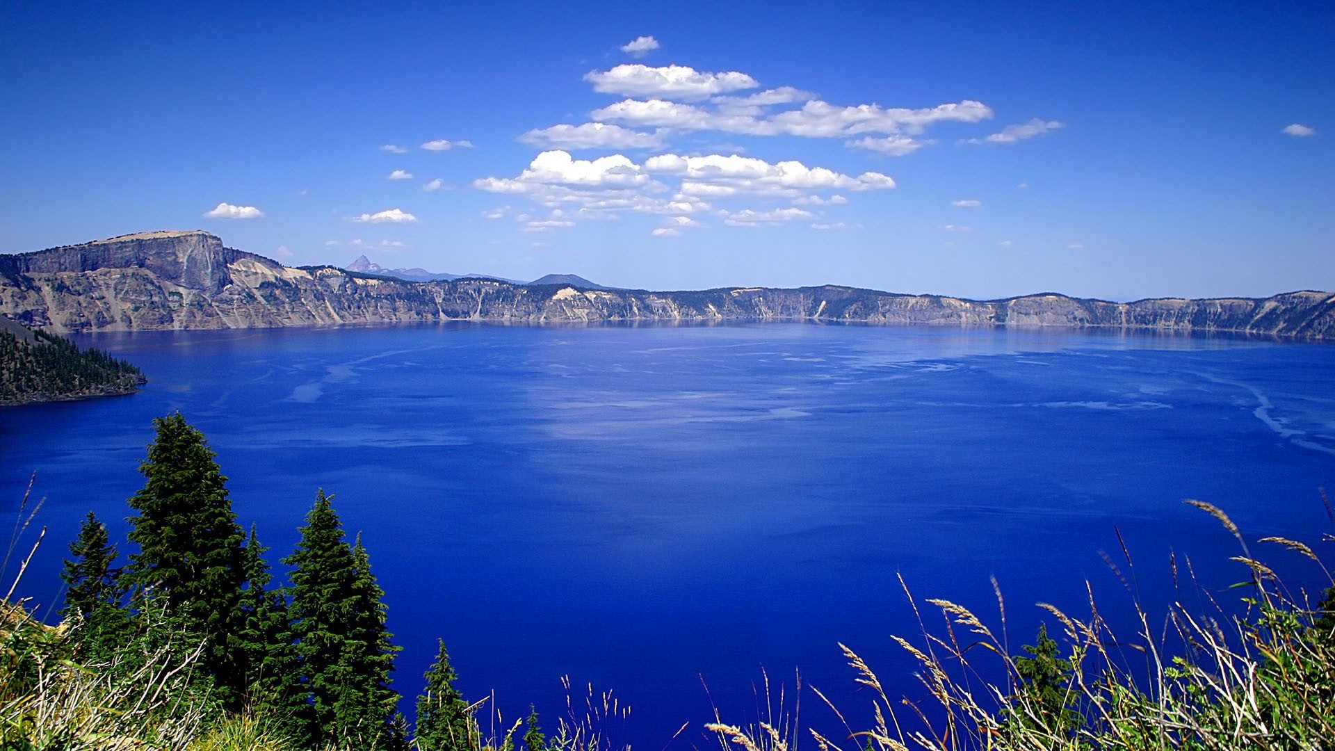 Crater Lake National Park landscape with blue water and mountains HD Wallpaper