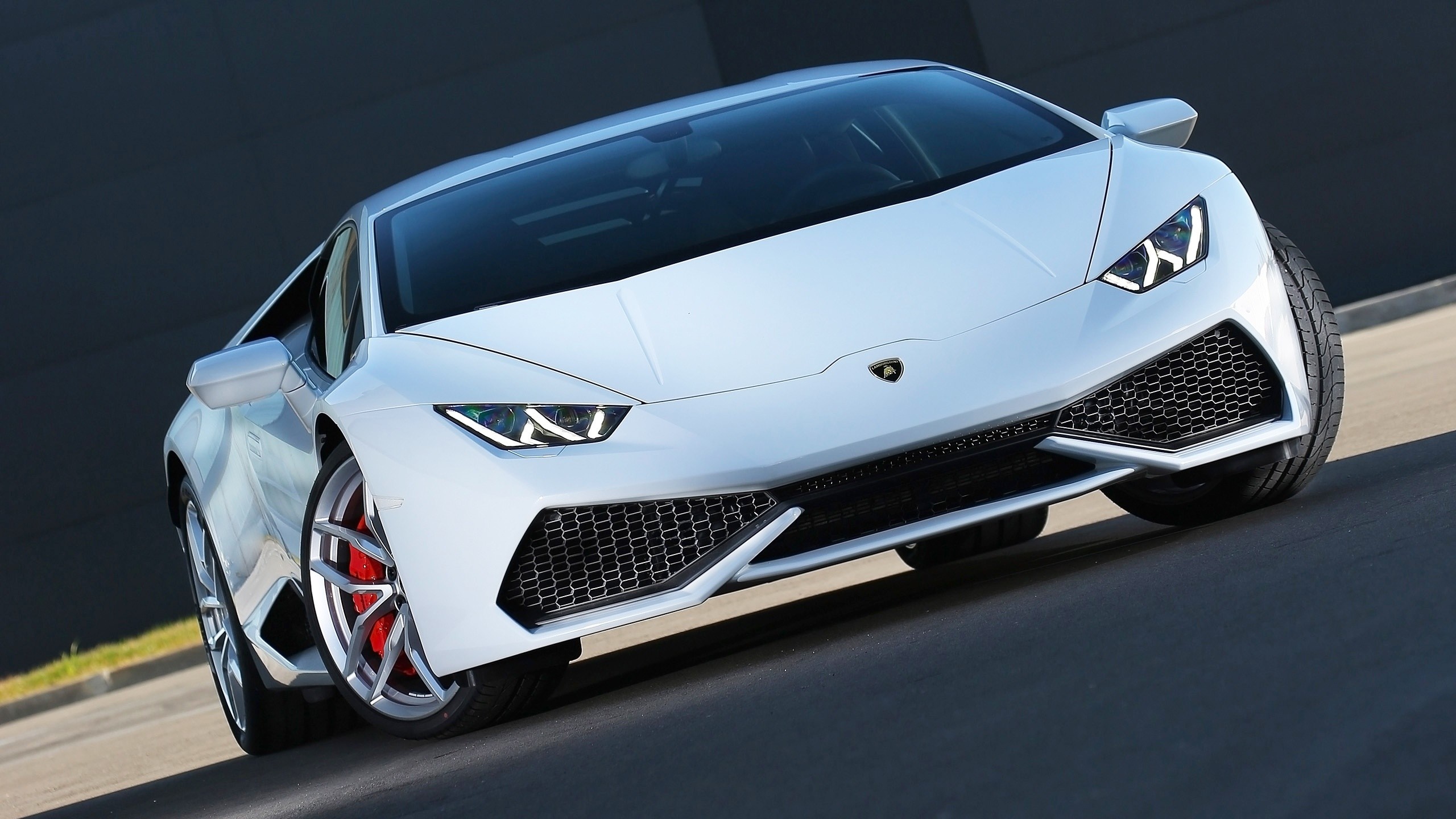 White Lamborghini Huracan parked on a road HD Wallpaper