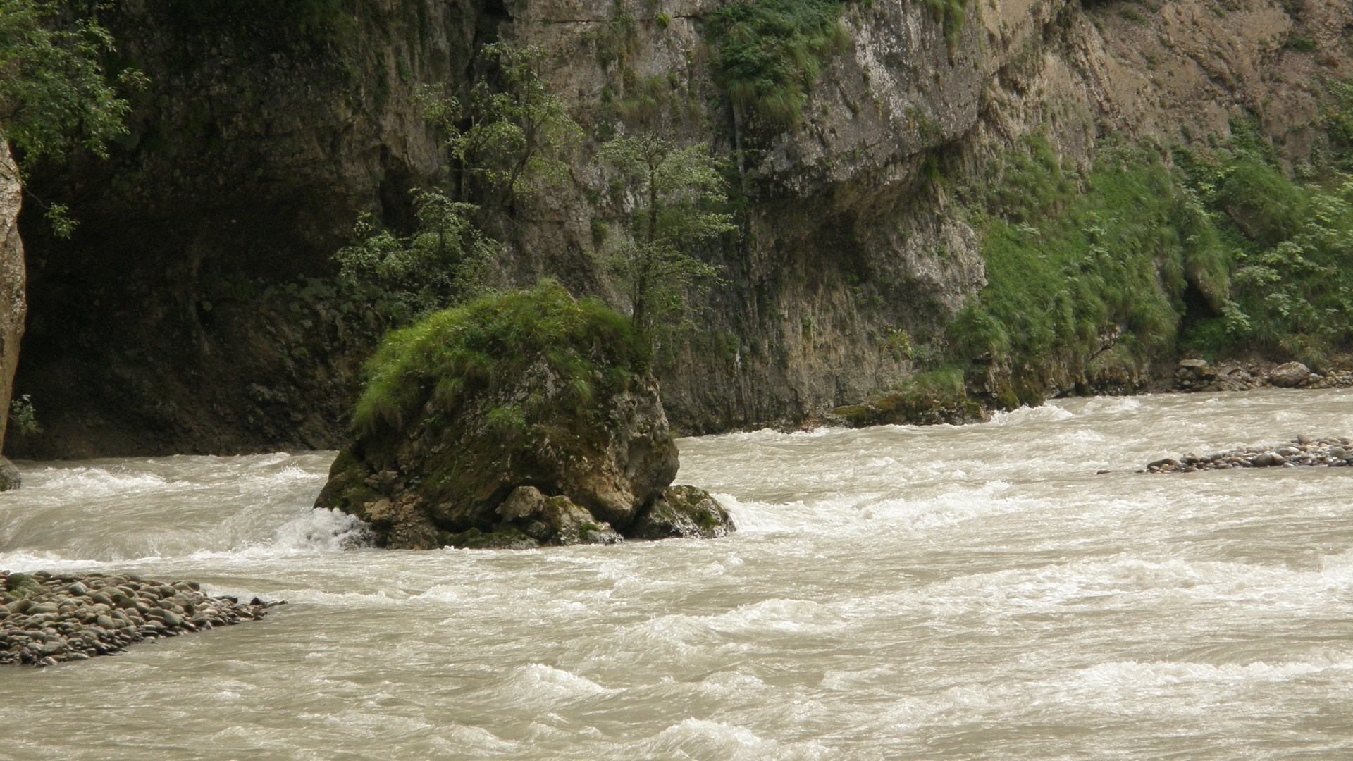 Mountain river flowing through a rocky gorge with vegetation HD Wallpaper