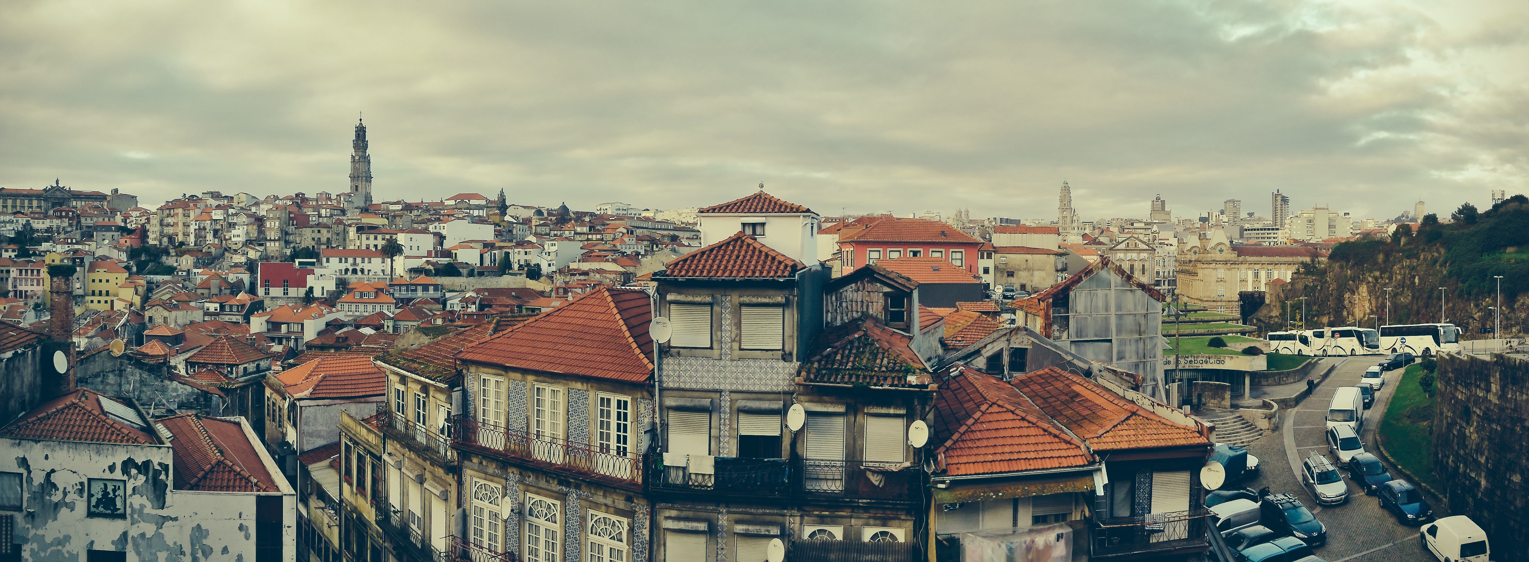 Porto cityscape with historic buildings and a distant tower HD Wallpaper