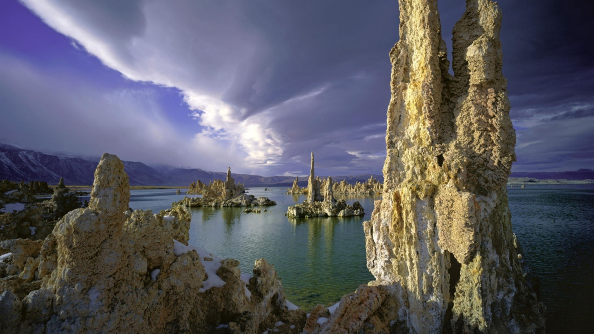 Tufa formations in Mono Lake under a dramatic sky HD Wallpaper