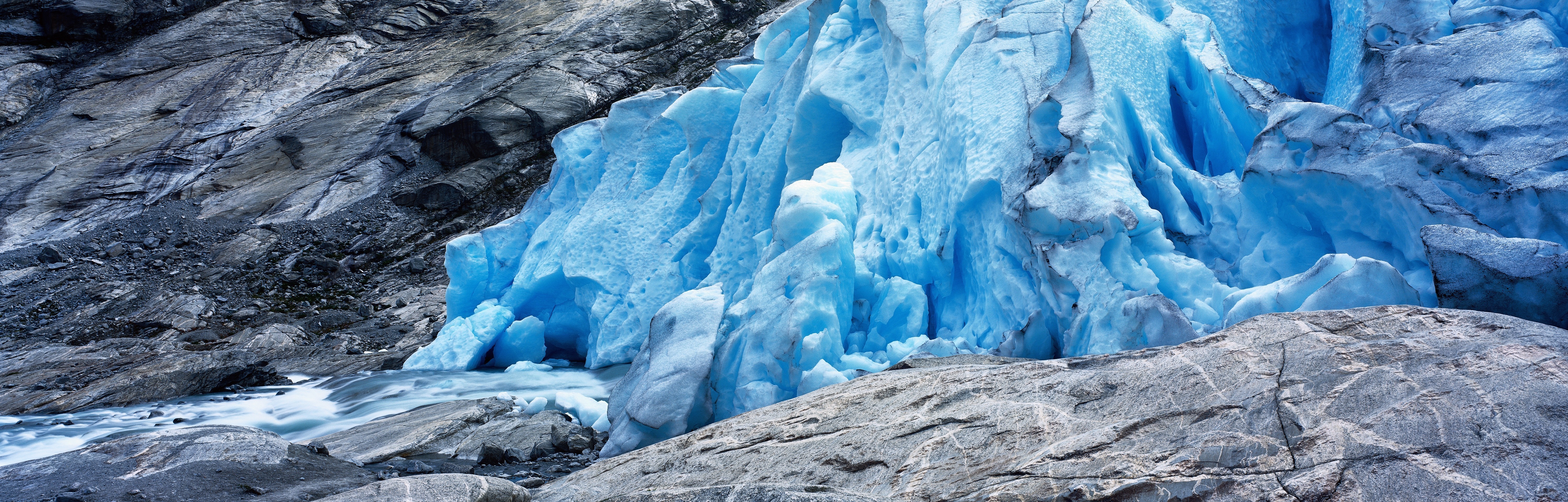 Blue glacier ice formation with rocky mountain and river HD Wallpaper
