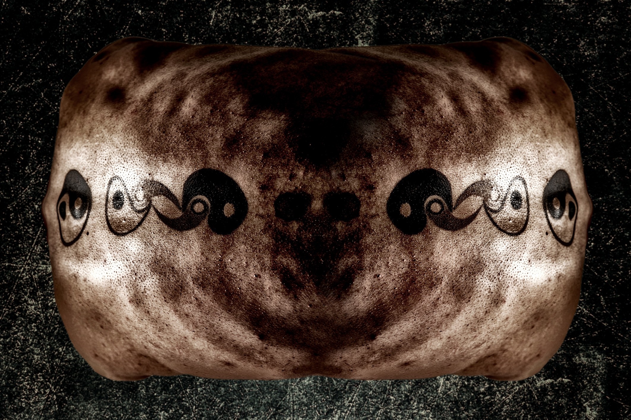 Surreal skull-like head with yin-yang designs HD Wallpaper