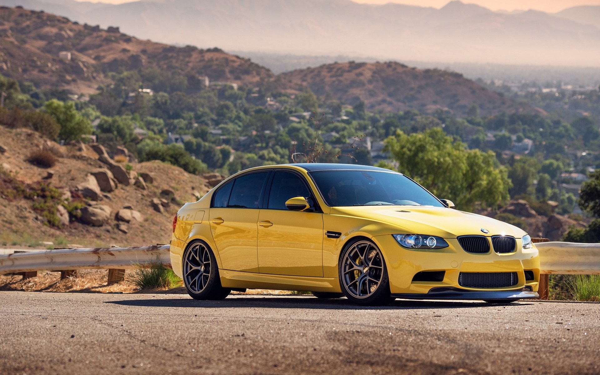 Yellow BMW M3 Sedan on a Mountain Road HD Wallpaper