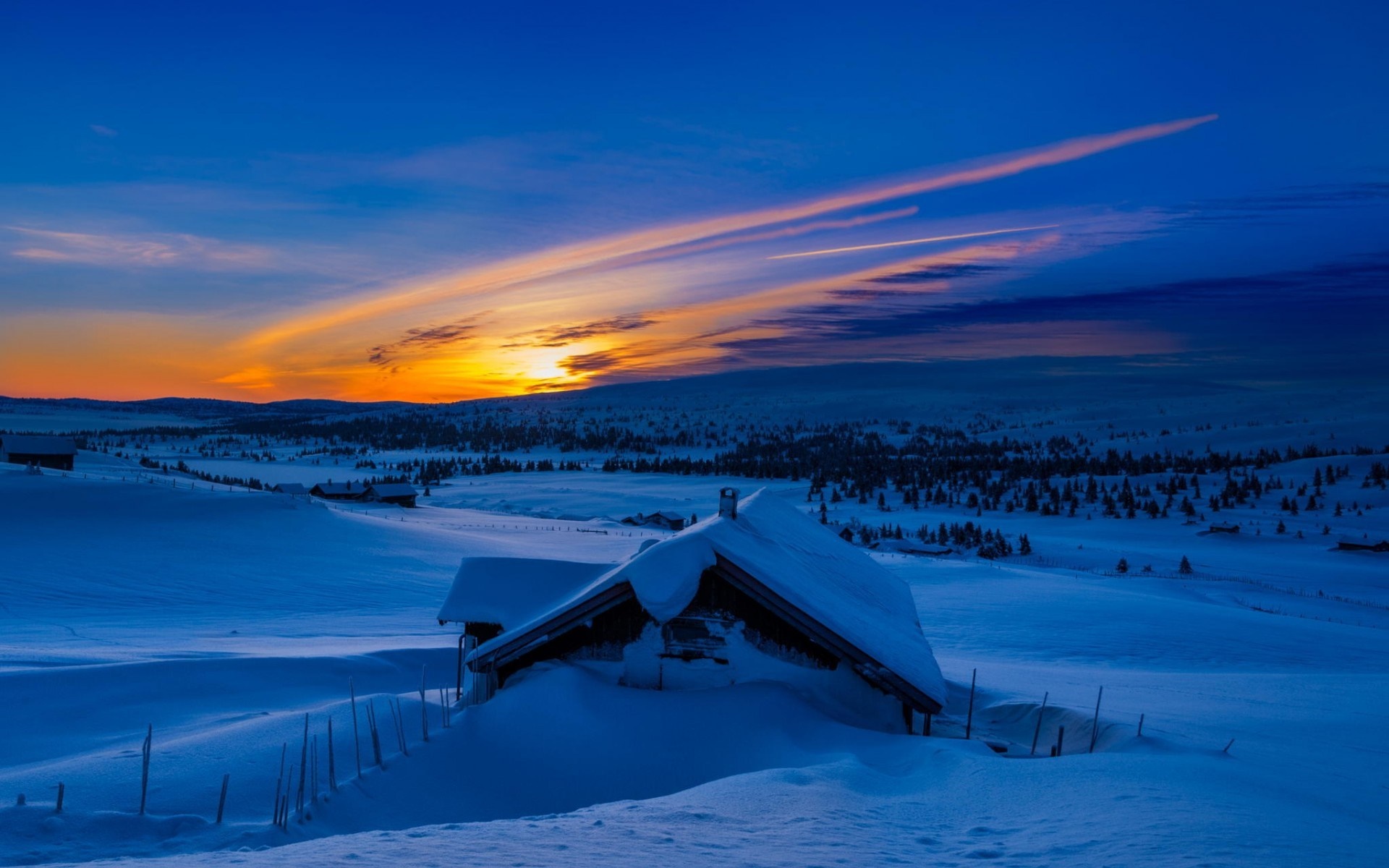 Snowy cabin at sunset with colorful sky HD Wallpaper