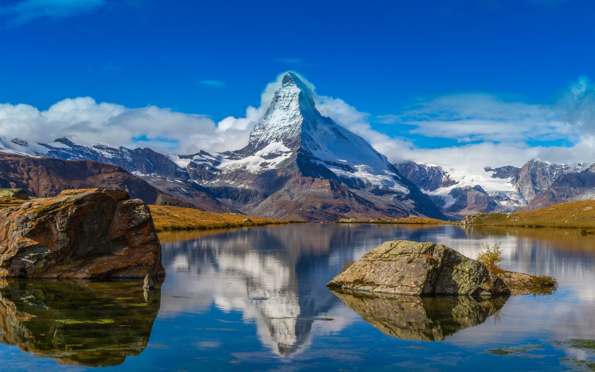 Matterhorn mountain reflected in a lake in the Alps HD Wallpaper