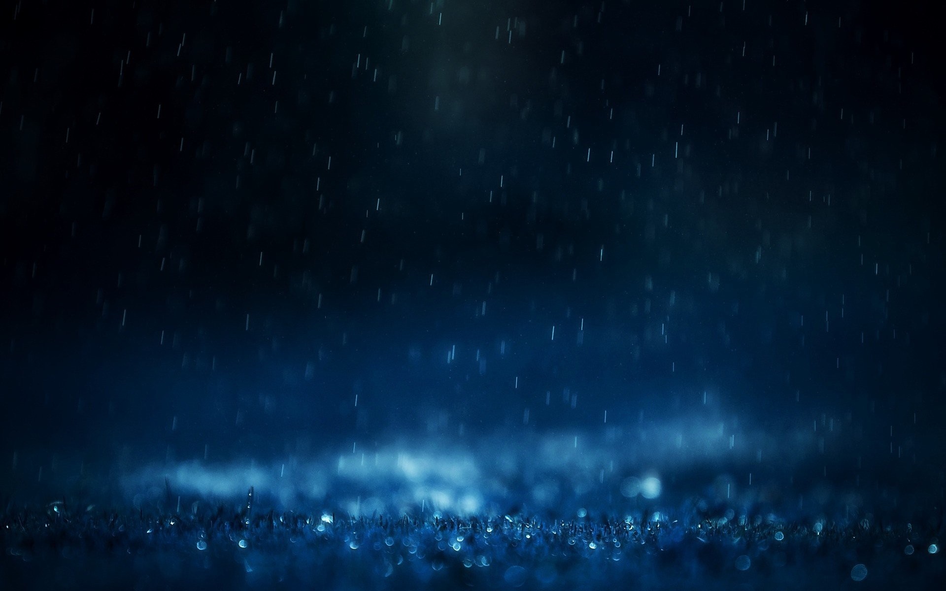 Rain falling at night with bokeh lights HD Wallpaper