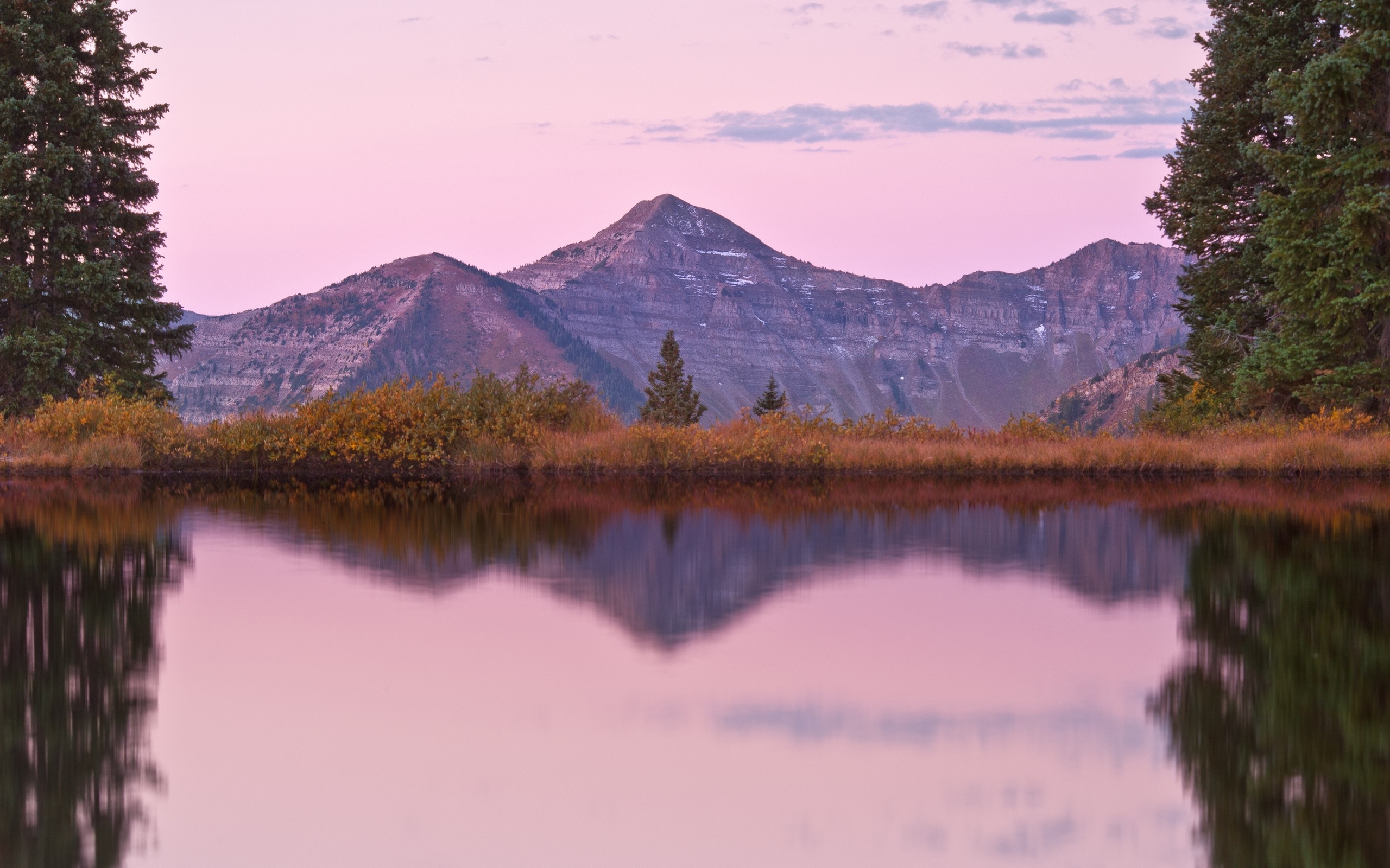 Mountain reflection in a lake at sunset HD Wallpaper