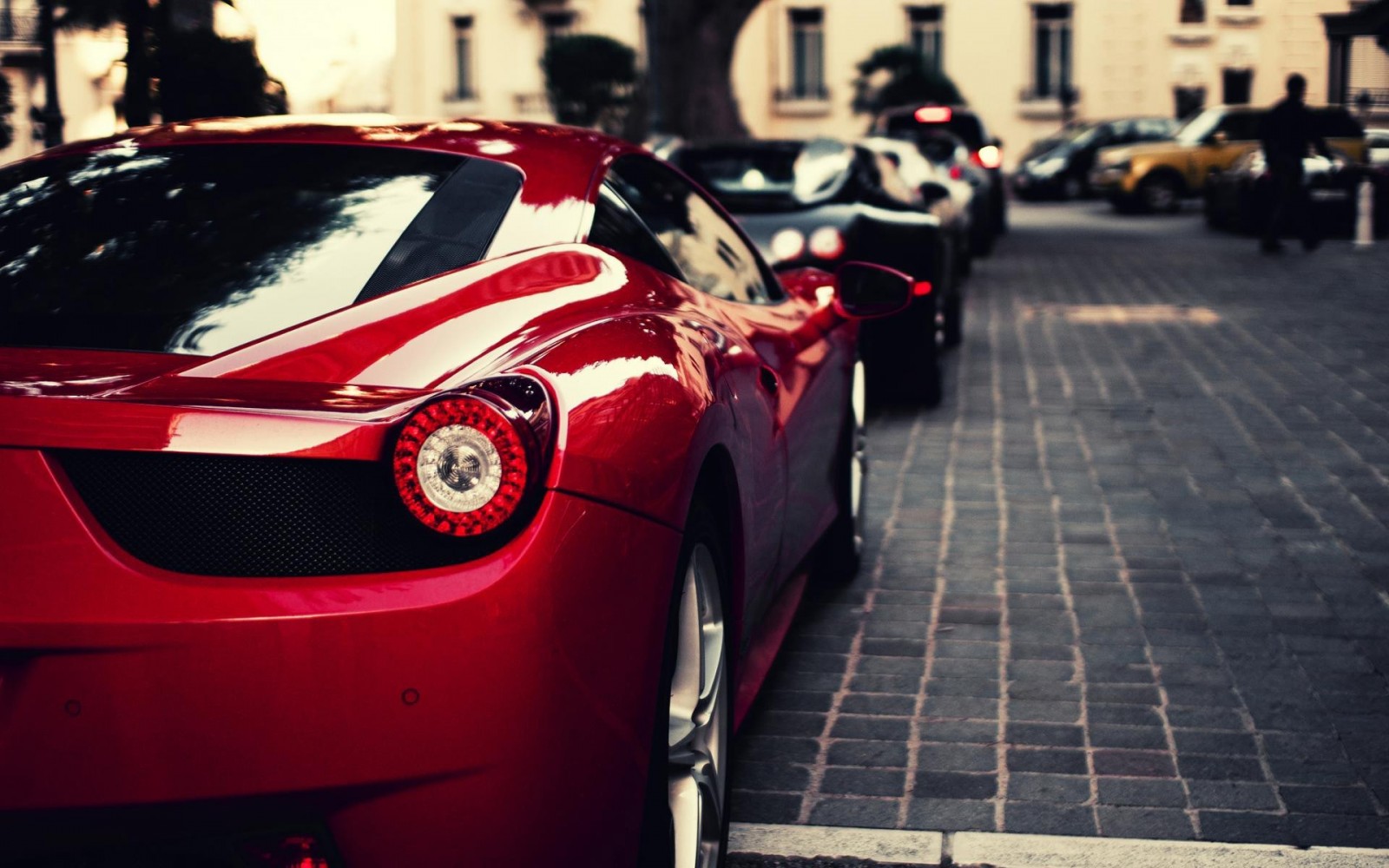 Red Ferrari 458 parked on cobblestone street HD Wallpaper