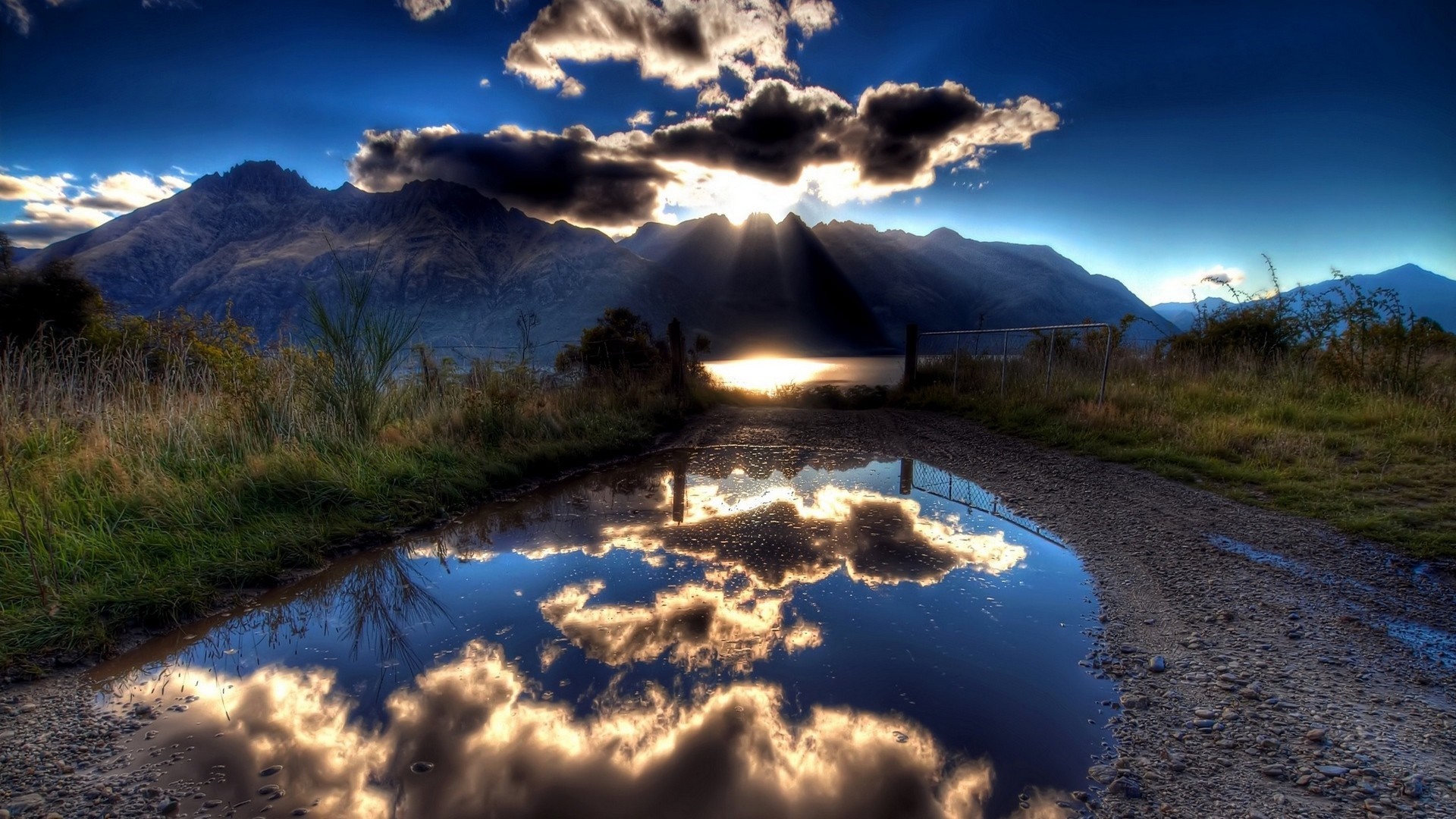 Sunlight over mountains and lake reflection HD Wallpaper
