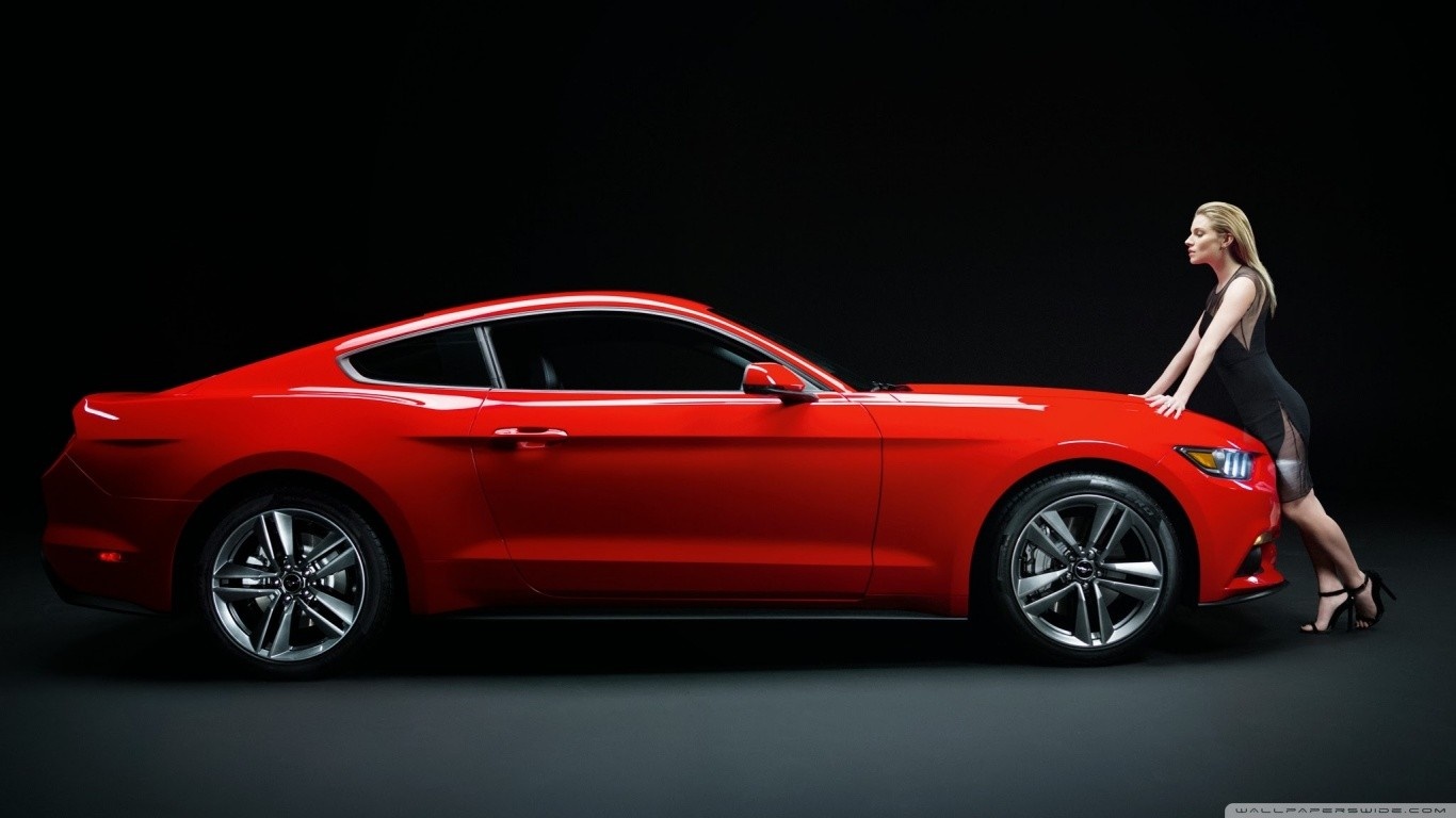 Woman leaning on a red Ford Mustang HD Wallpaper
