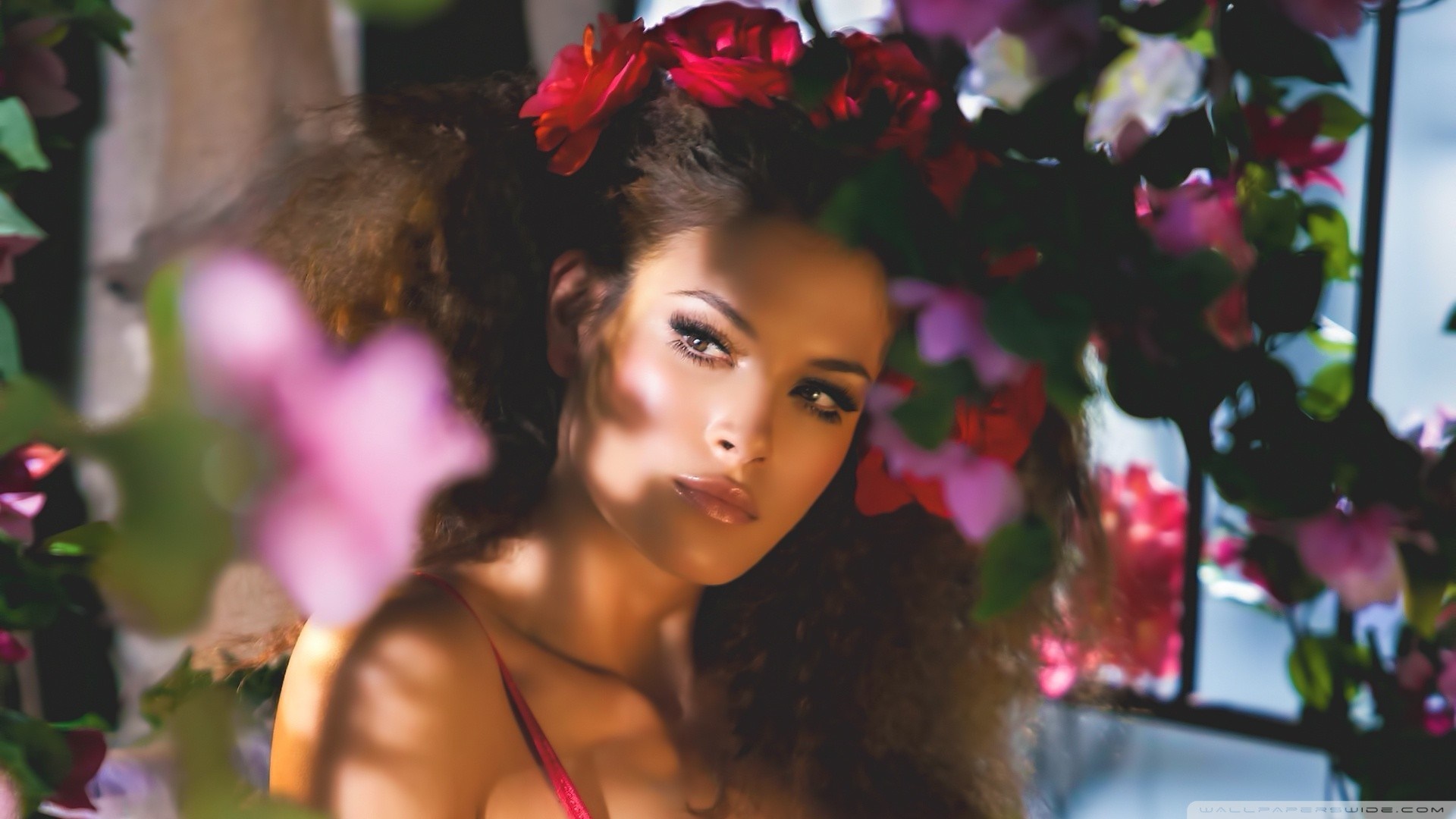 Woman with flowers in her hair HD Wallpaper
