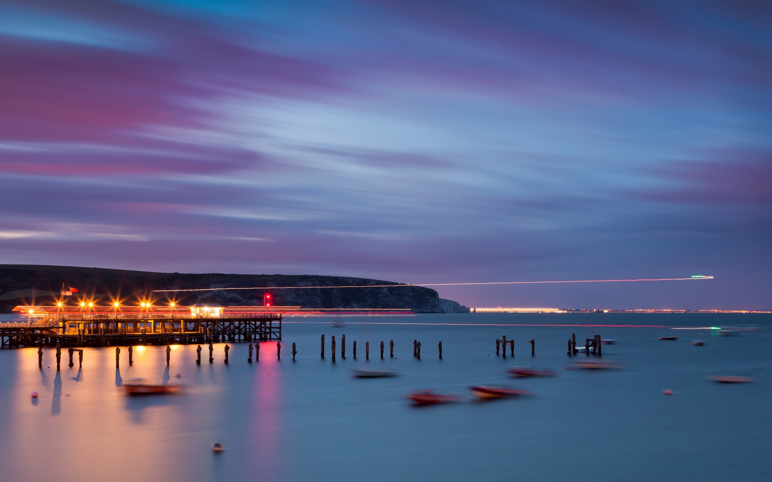 Pier with lights over the sea at dusk HD Wallpaper