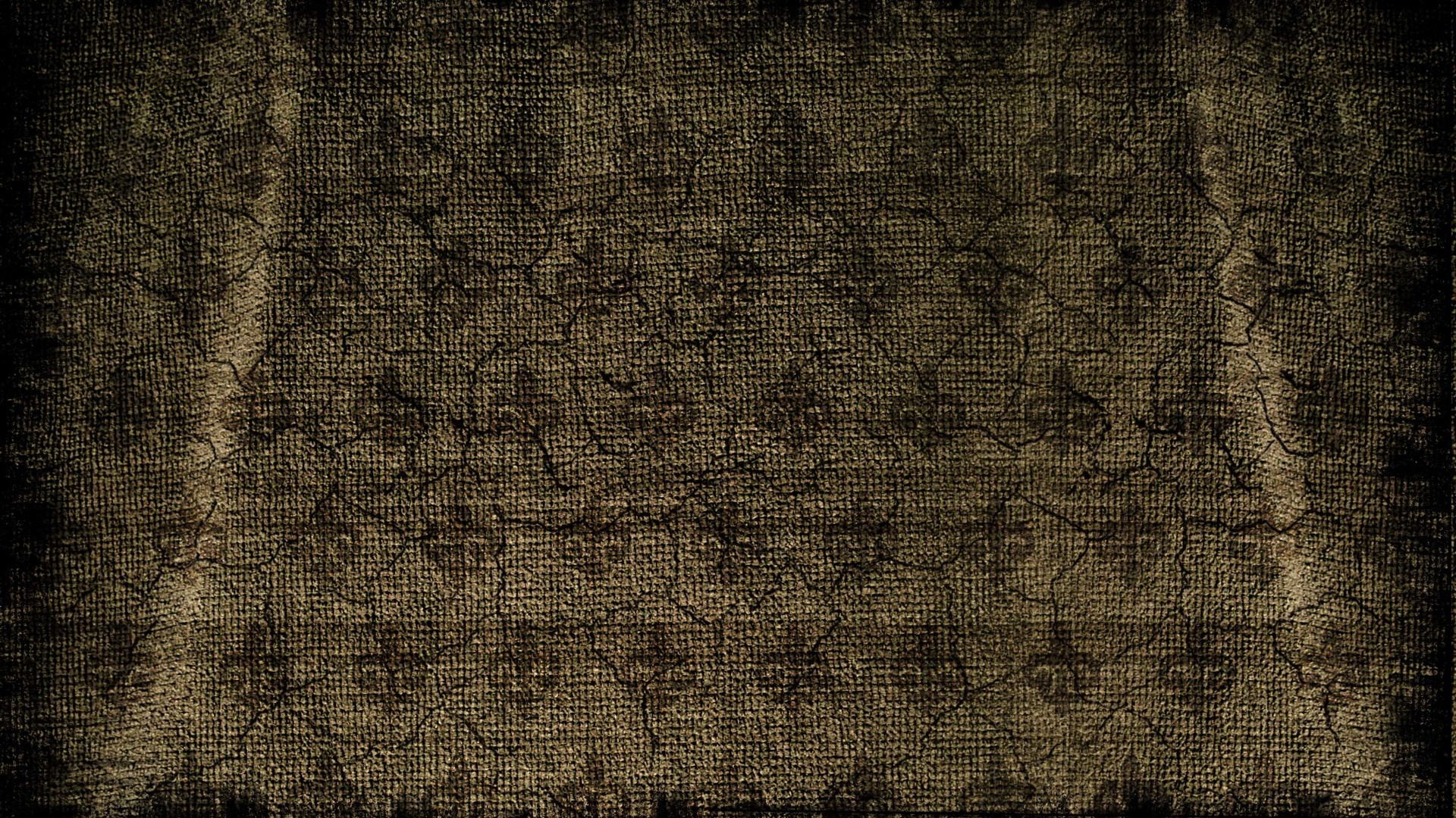 Cracked brown textured surface with dark edges HD Wallpaper
