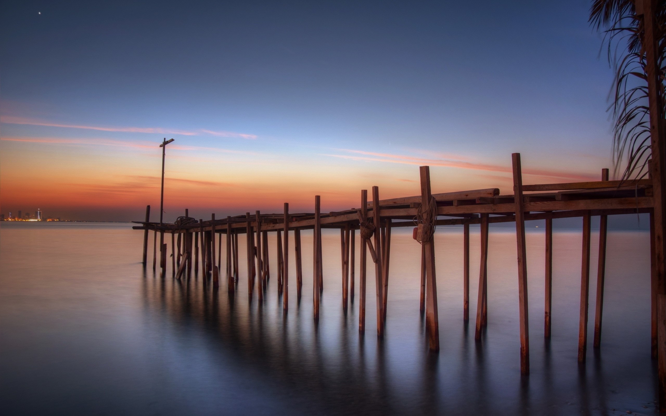 Wooden pier at sunset over the sea HD Wallpaper