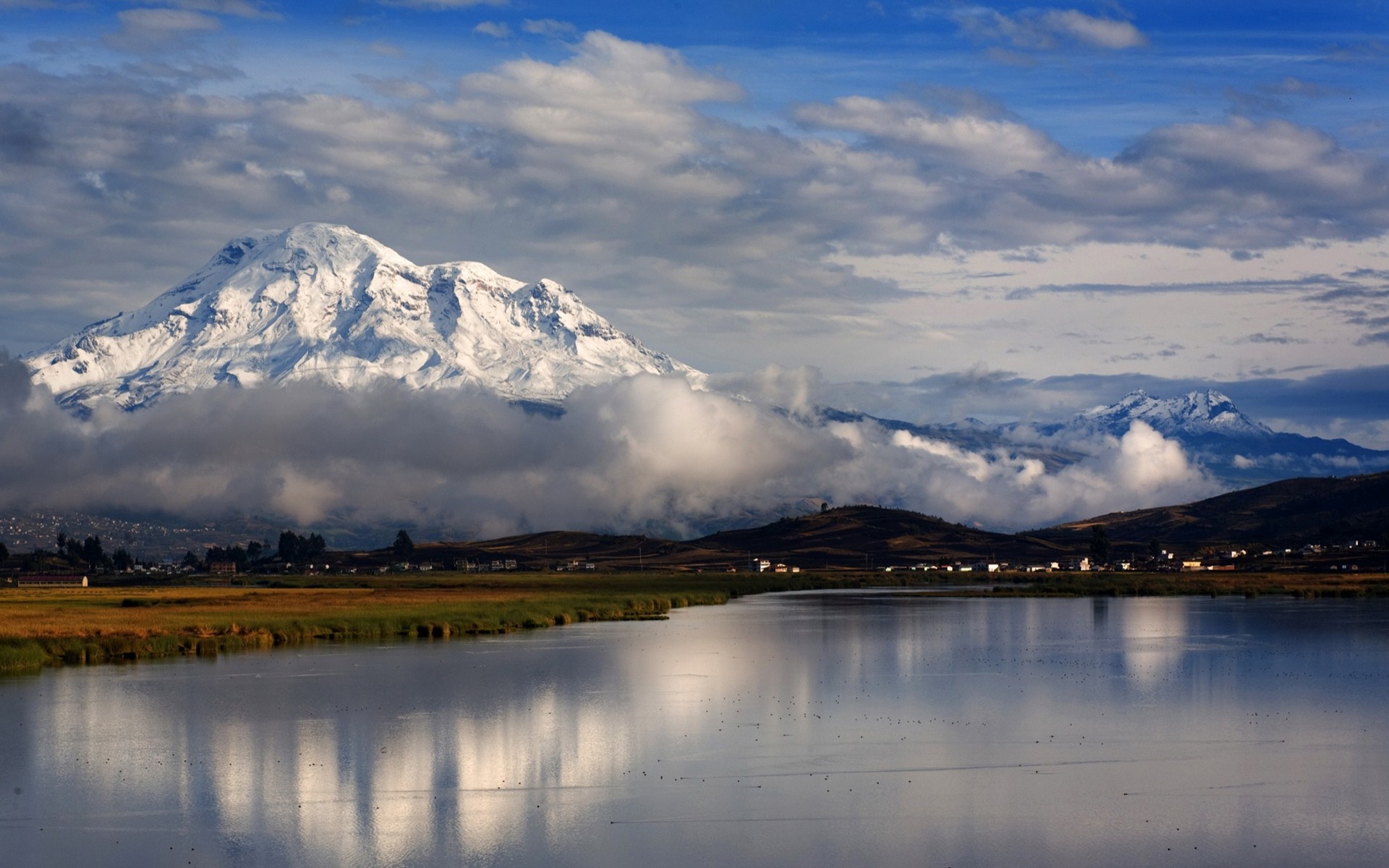 Snow-capped mountain reflected in a lake at sunrise HD Wallpaper
