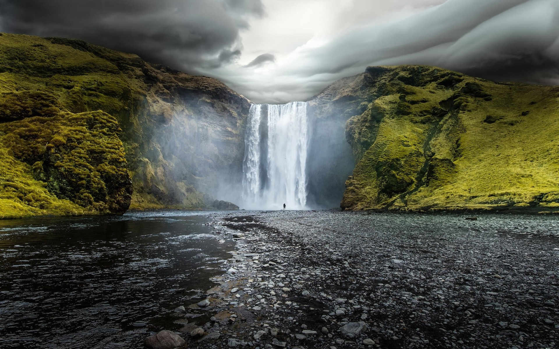Skogafoss Waterfall in Iceland with a lone figure HD Wallpaper