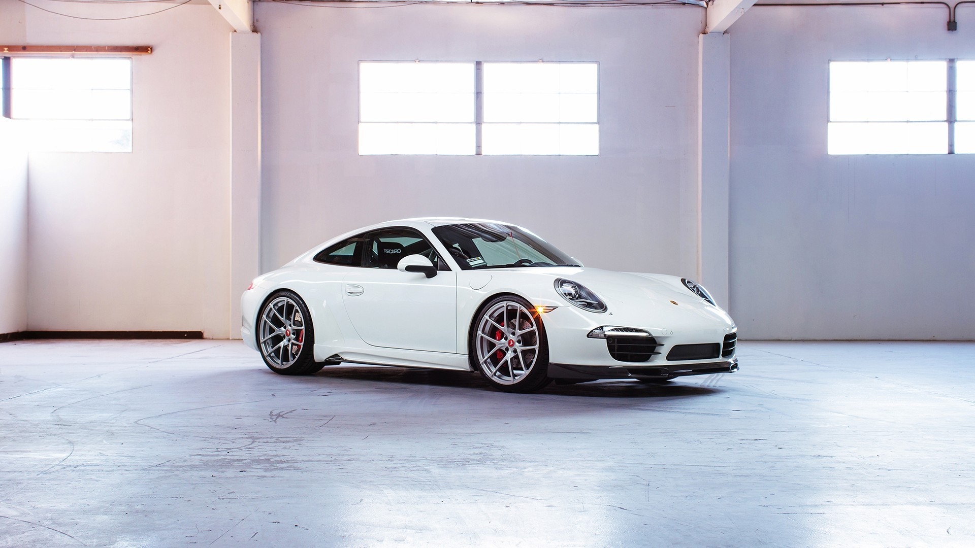 White Porsche 911 sports car in a warehouse HD Wallpaper
