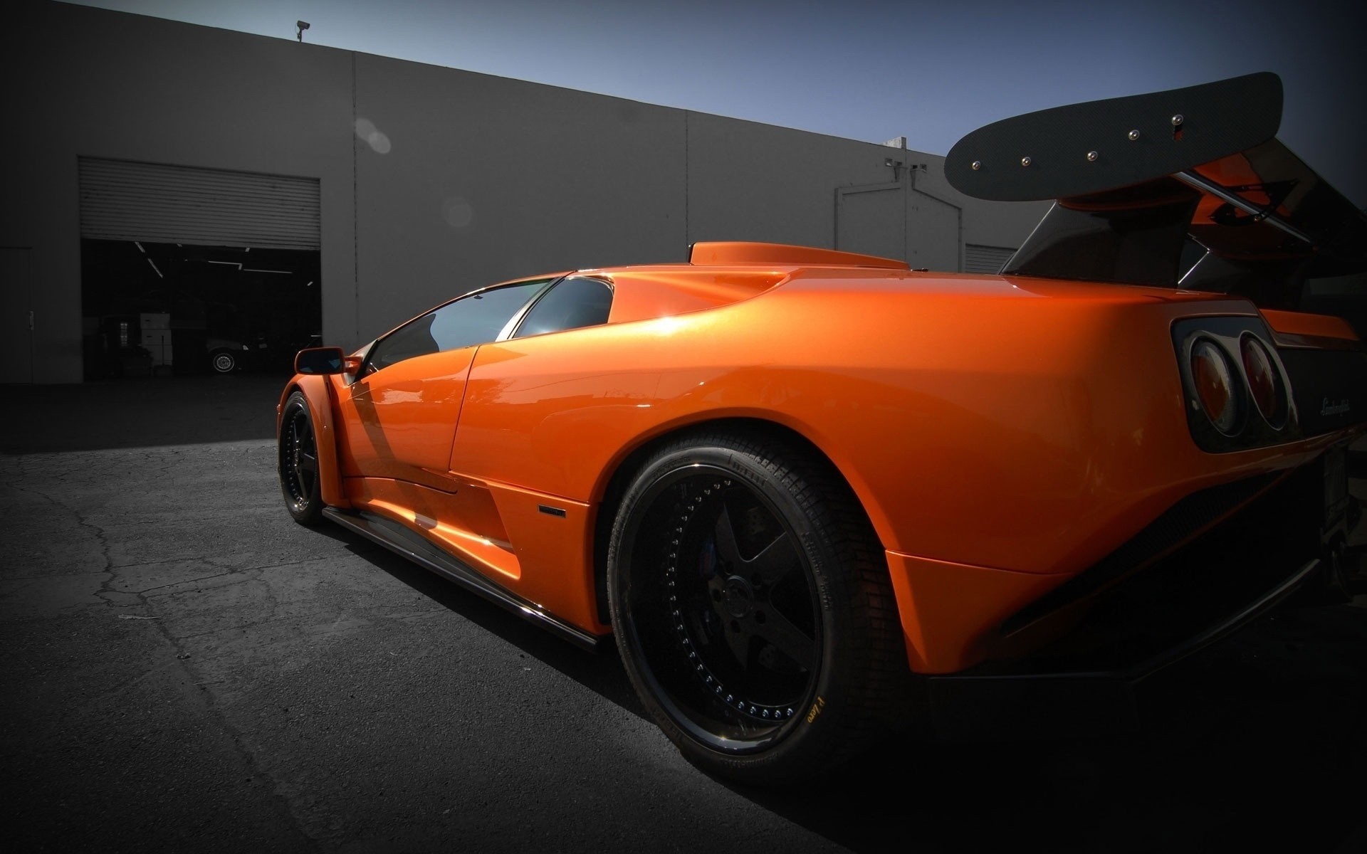 Orange Lamborghini Murcielago with large rear wing HD Wallpaper